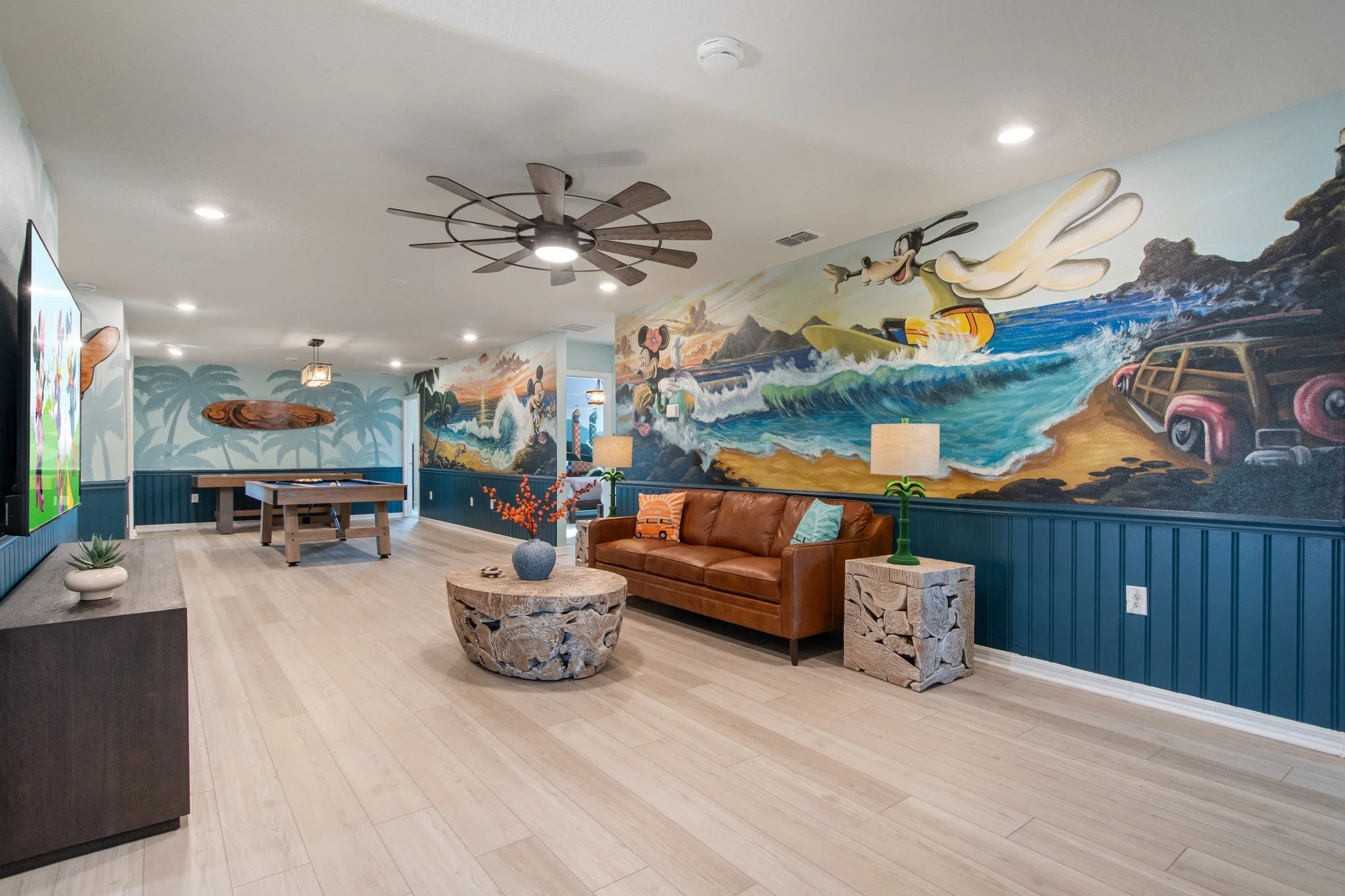 Family-friendly luxury private villa in Windsor Cay Resort near Orlando, Disney, and Universal Studios. Mickey and Friends themed bonus room, Disney wall murals, TVs in every room, spacious living, 10-bedroom, 8-bath home with private pool and spa.