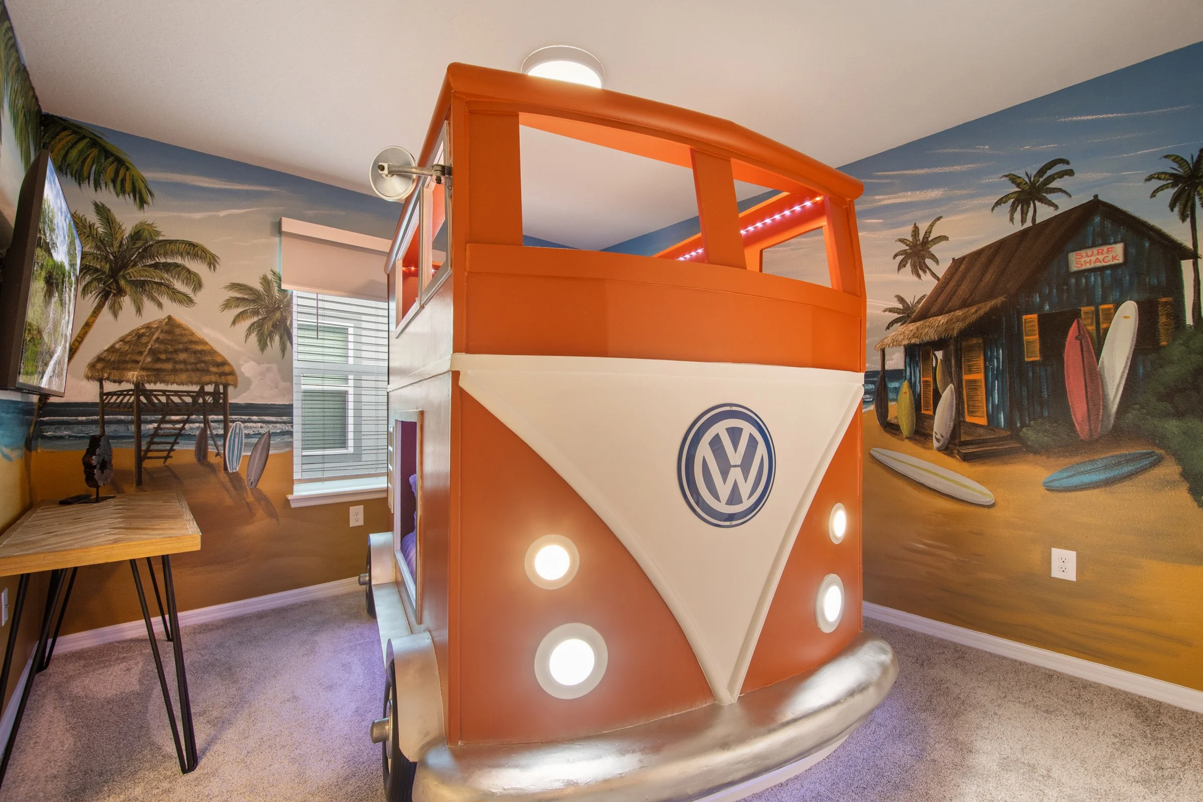 Kid-friendly private villa in Windsor Cay Resort near Orlando, Disney, and Universal Studios. VW Bus bunk room with surf theme, TVs in every bedroom, spacious living, 10-bedroom, 8-bath home with private pool and spa.