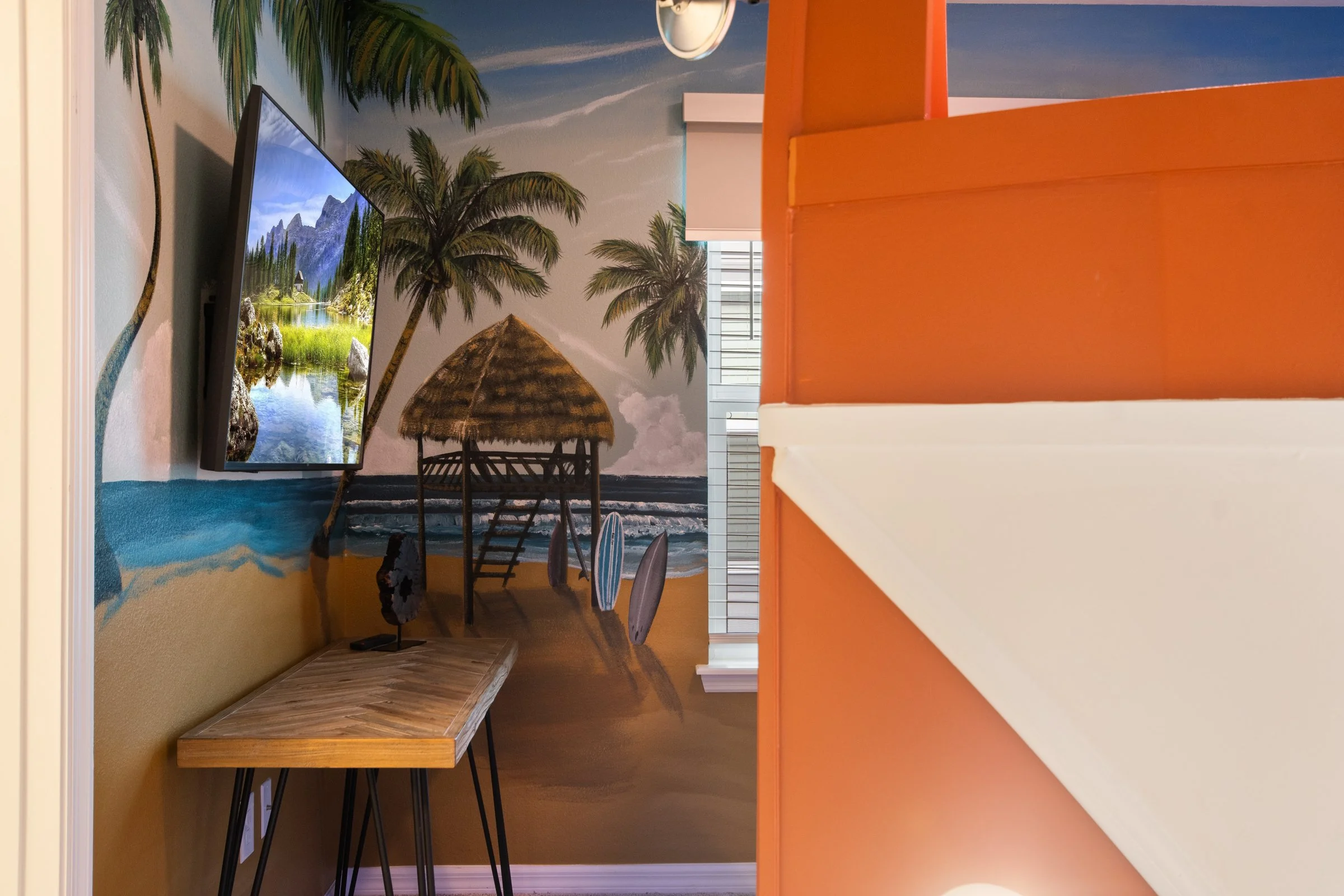 Kid-friendly private villa in Windsor Cay Resort near Orlando, Disney, and Universal Studios. VW Bus bunk room with surf theme, TVs in every bedroom, spacious living, 10-bedroom, 8-bath home with private pool and spa.