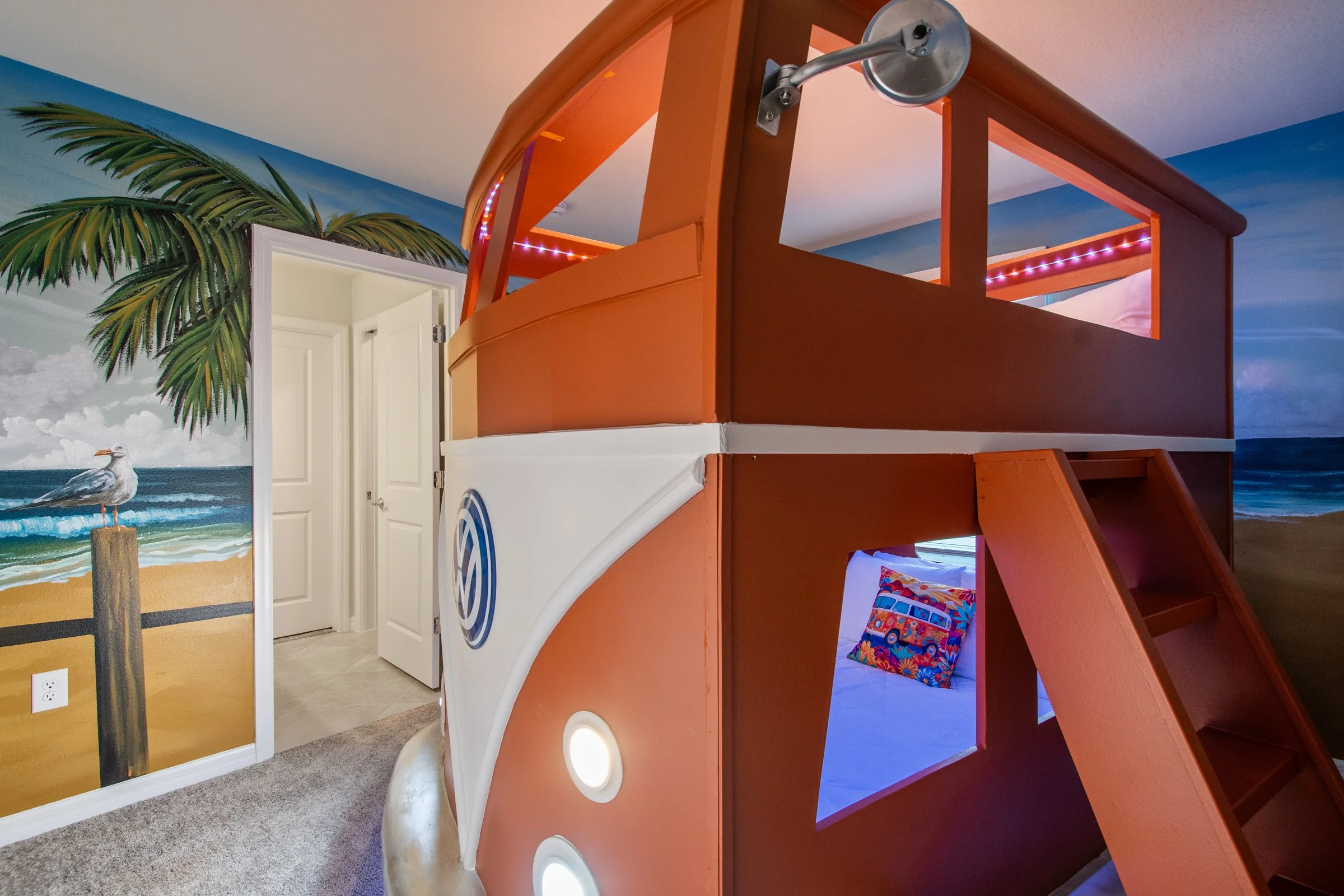 Kid-friendly private villa in Windsor Cay Resort near Orlando, Disney, and Universal Studios. VW Bus bunk room with surf theme, TVs in every bedroom, spacious living, 10-bedroom, 8-bath home with private pool and spa.
