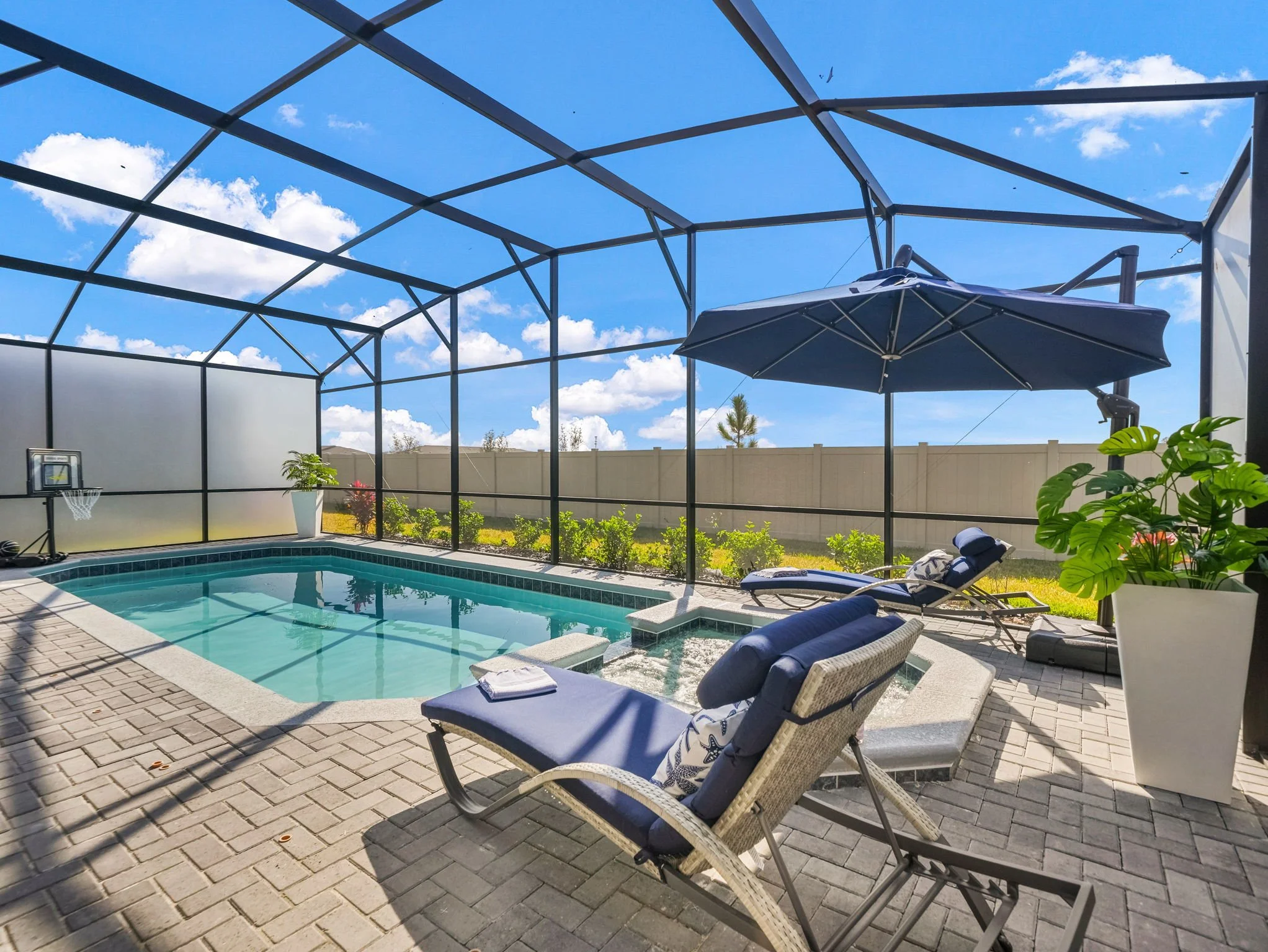 Lounge by the Private Pool and Spa at the private villa in Windsor Cay Resort near Orlando, Disney, and Universal Studios. Great for families and large parties, a 10-bedroom, 8-bath home with spacious living.
