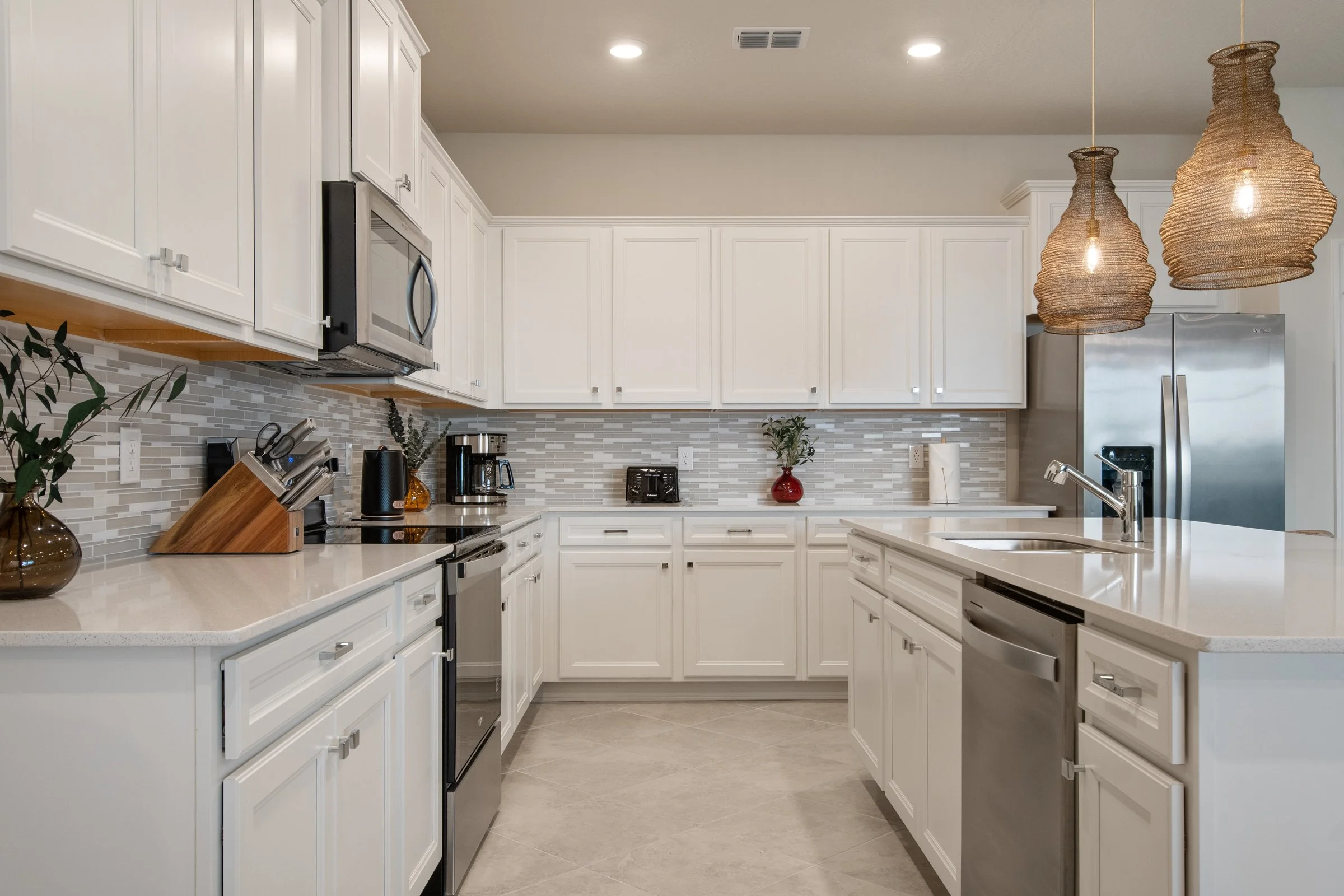 Beautiful kitchen in vacation home in Windsor Cay Resort near Orlando, Disney, and Universal Studios. Family-friendly, open concept, 10-bedroom, 8-bath home with private pool and spa.