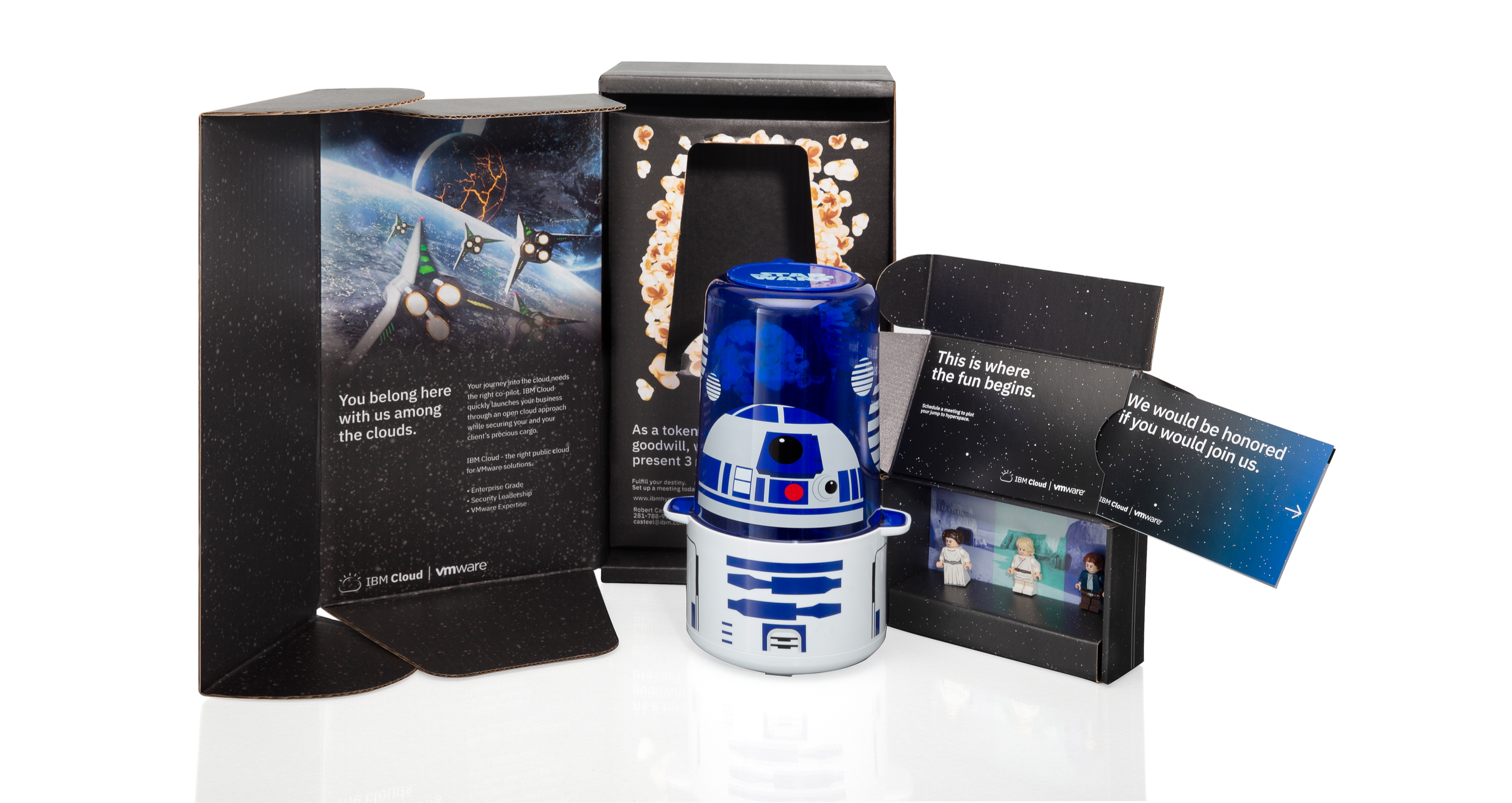 A Star Wars R2-D2 themed LED night light in a box with space-themed packaging and a collectible figurine display.