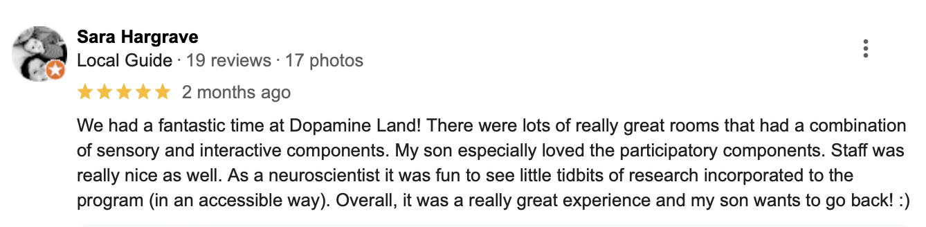 Screenshot of a Google review from Sara Hargrave recommending Dopamine Land with five stars, praising interactive and sensory rooms, participatory components, and staff.