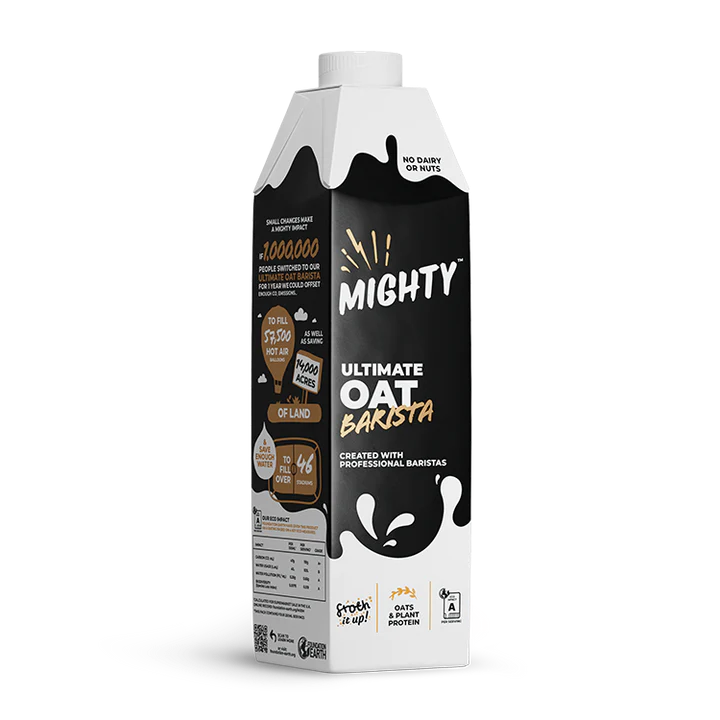 Packaging of Mighty Ultimate Oat Barista plant-based milk alternative with black, white, and tan design, featuring text indicating it contains no dairy or nuts, created with professional baristas, and promotes oat and plant protein.