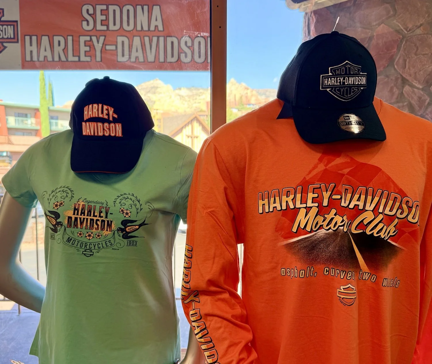 A display of customized shirts and sweatshirts in a shop at the Sedona Center.