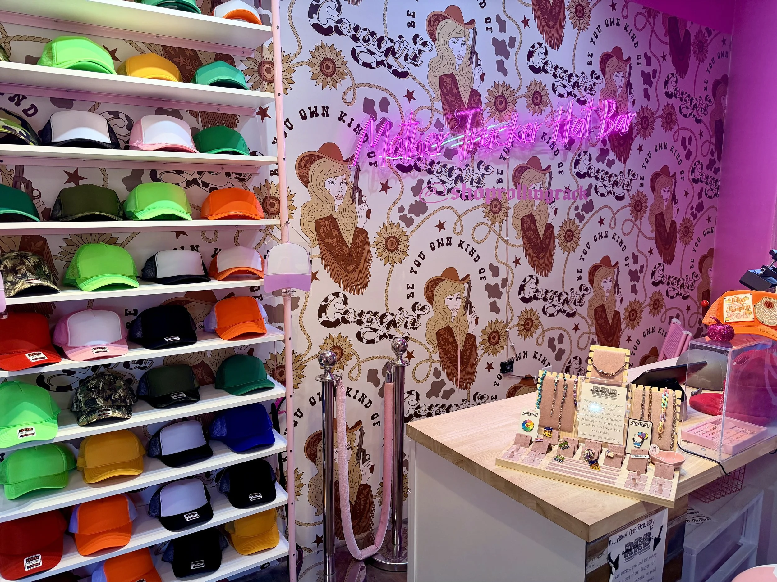 A display of customizable hats in a shop at the Sedona Center.