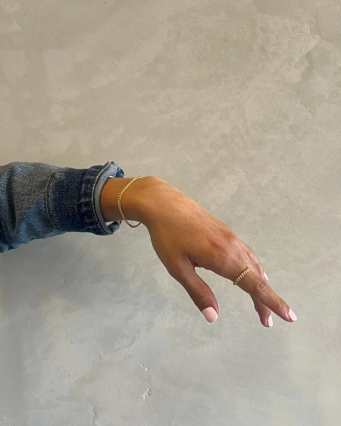 A hand models jewelry from a store in the Sedona Center.