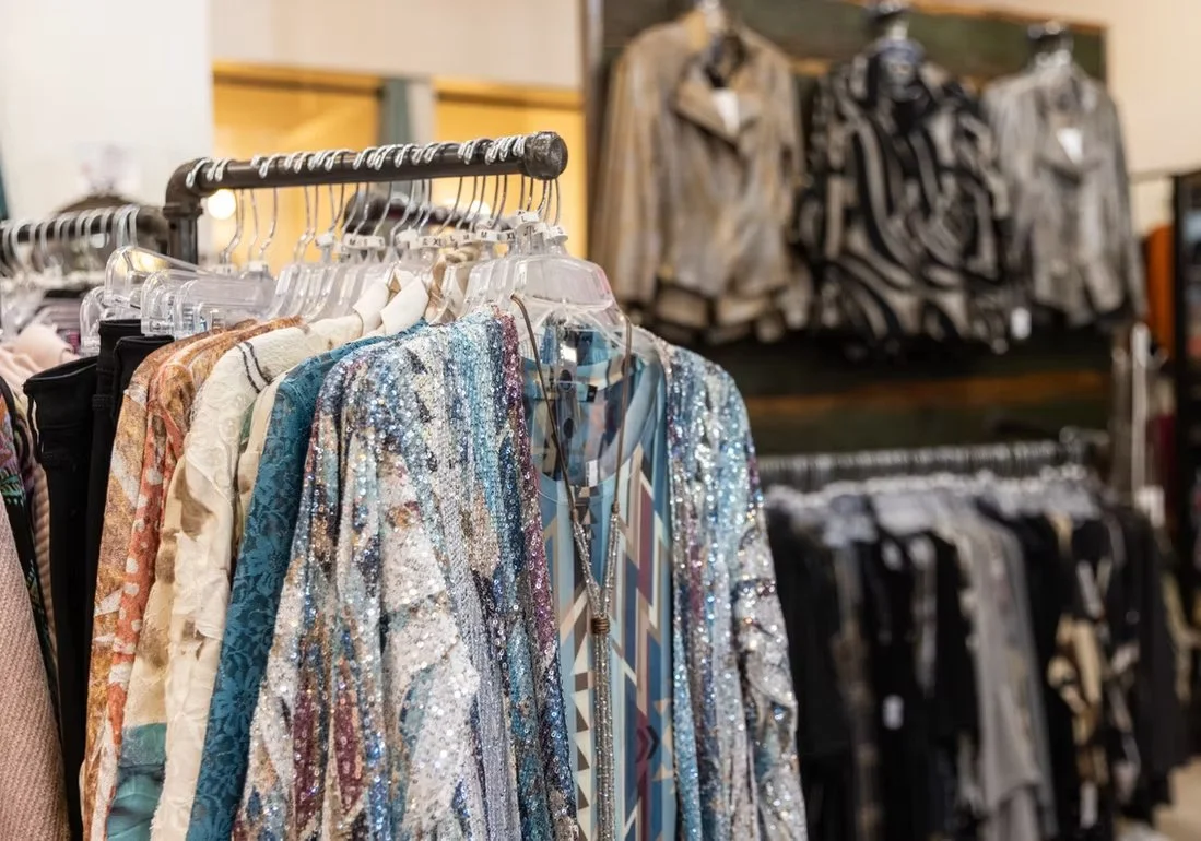 Clothing is displayed on a rack in a shop at the Sedona Center.