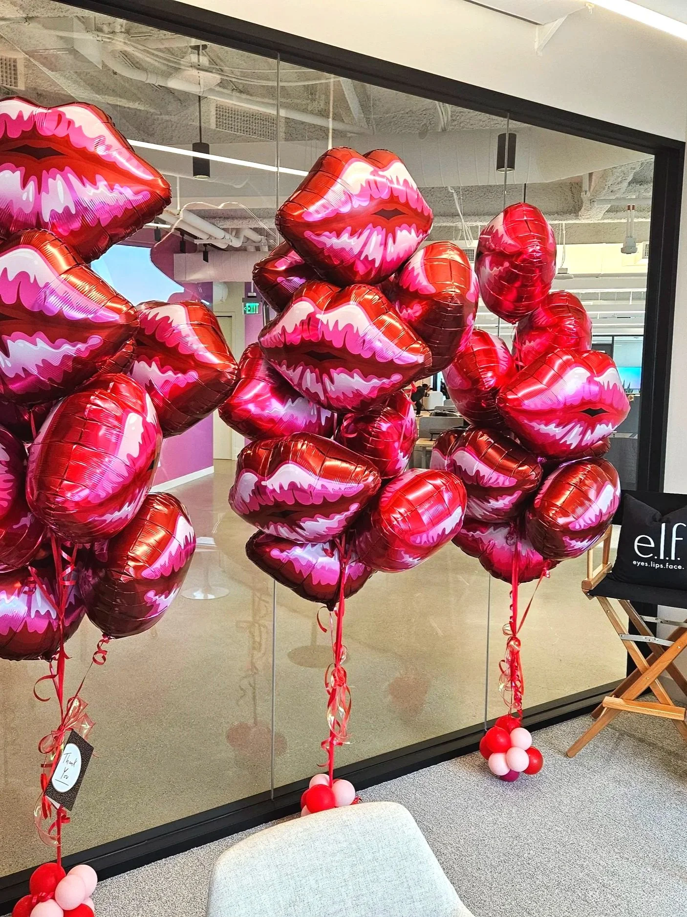 Bold and playful Valentine’s Day corporate decor featuring clusters of red metallic lip-shaped helium balloons. A stylish statement setup perfect for office celebrations, brand activations, and team appreciation events in the Bay Area. Designed to cr
