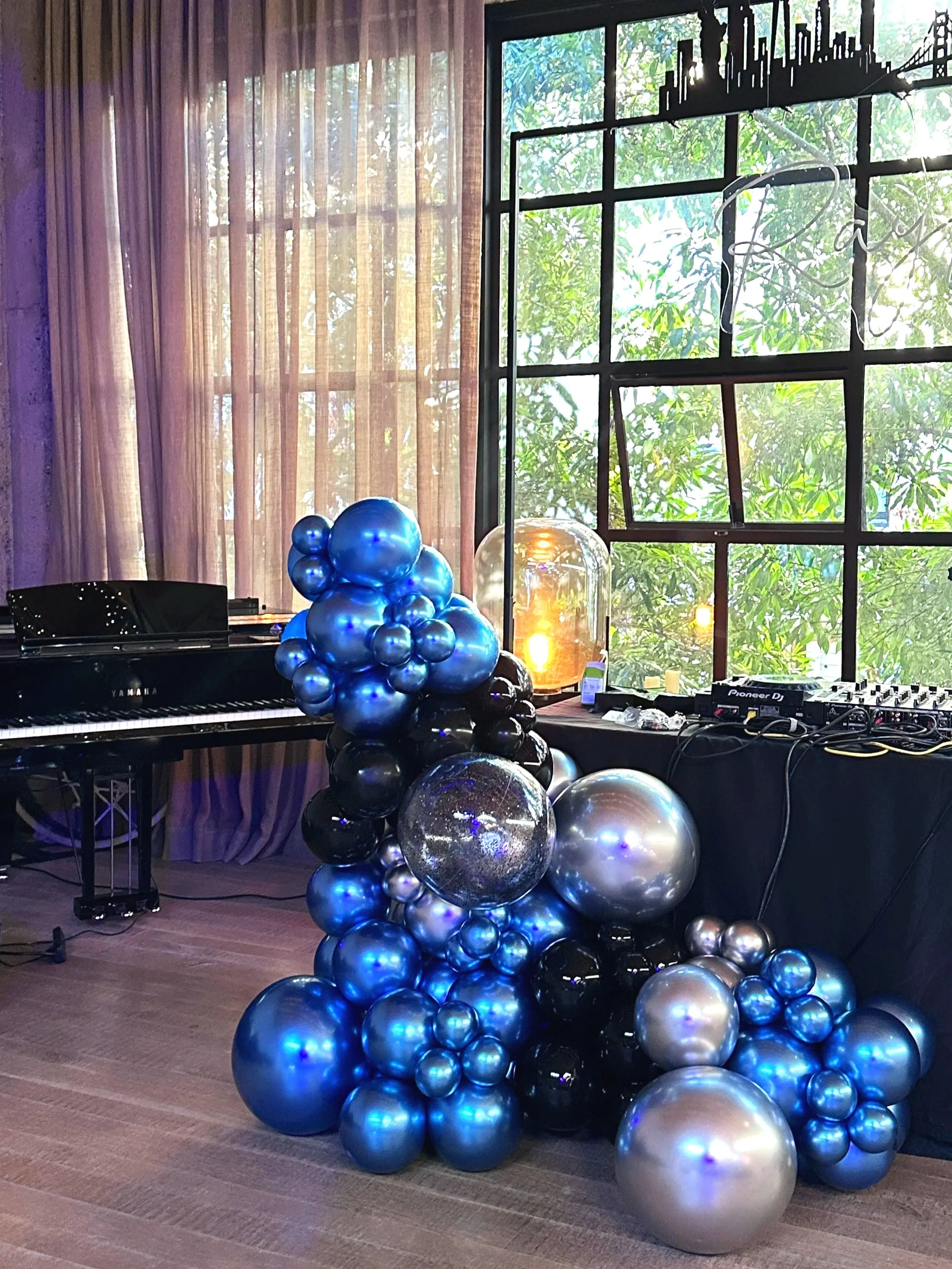 Luxury black and metallic balloon installation