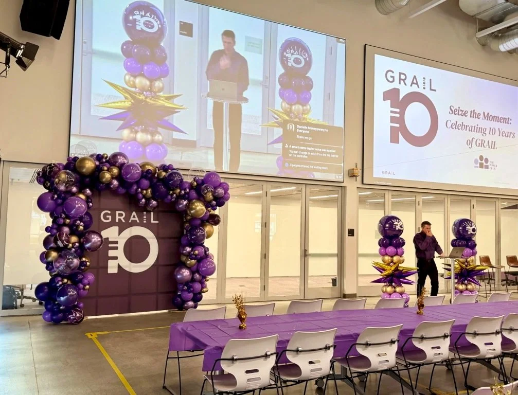 Purple branded balloon stage installation for a GRAIL conference and technology event in the San Francisco Bay Area.