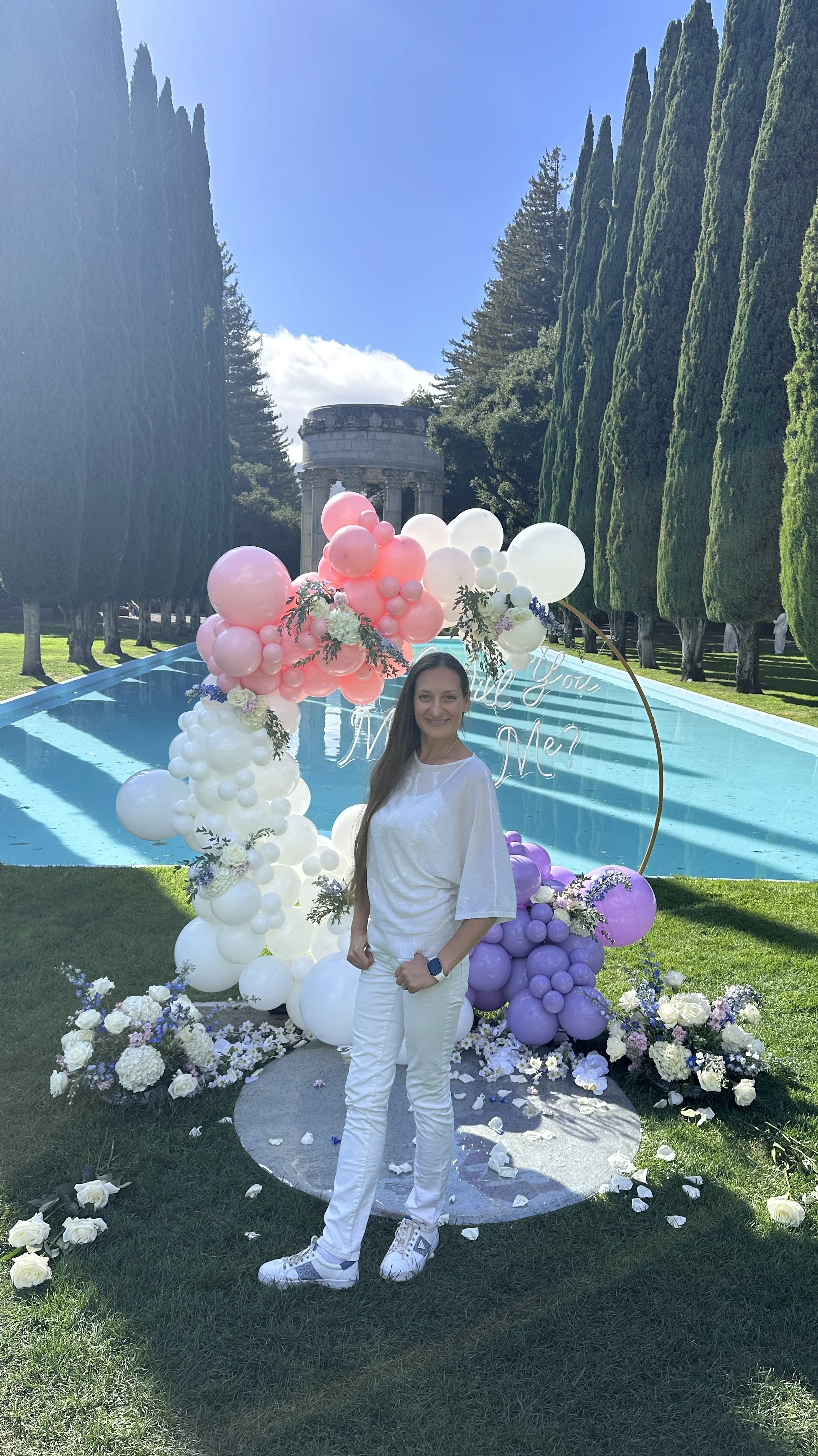 Marriage Proposal at Filoli Gardens | Pink, lavender and white balloon photo backdrop.