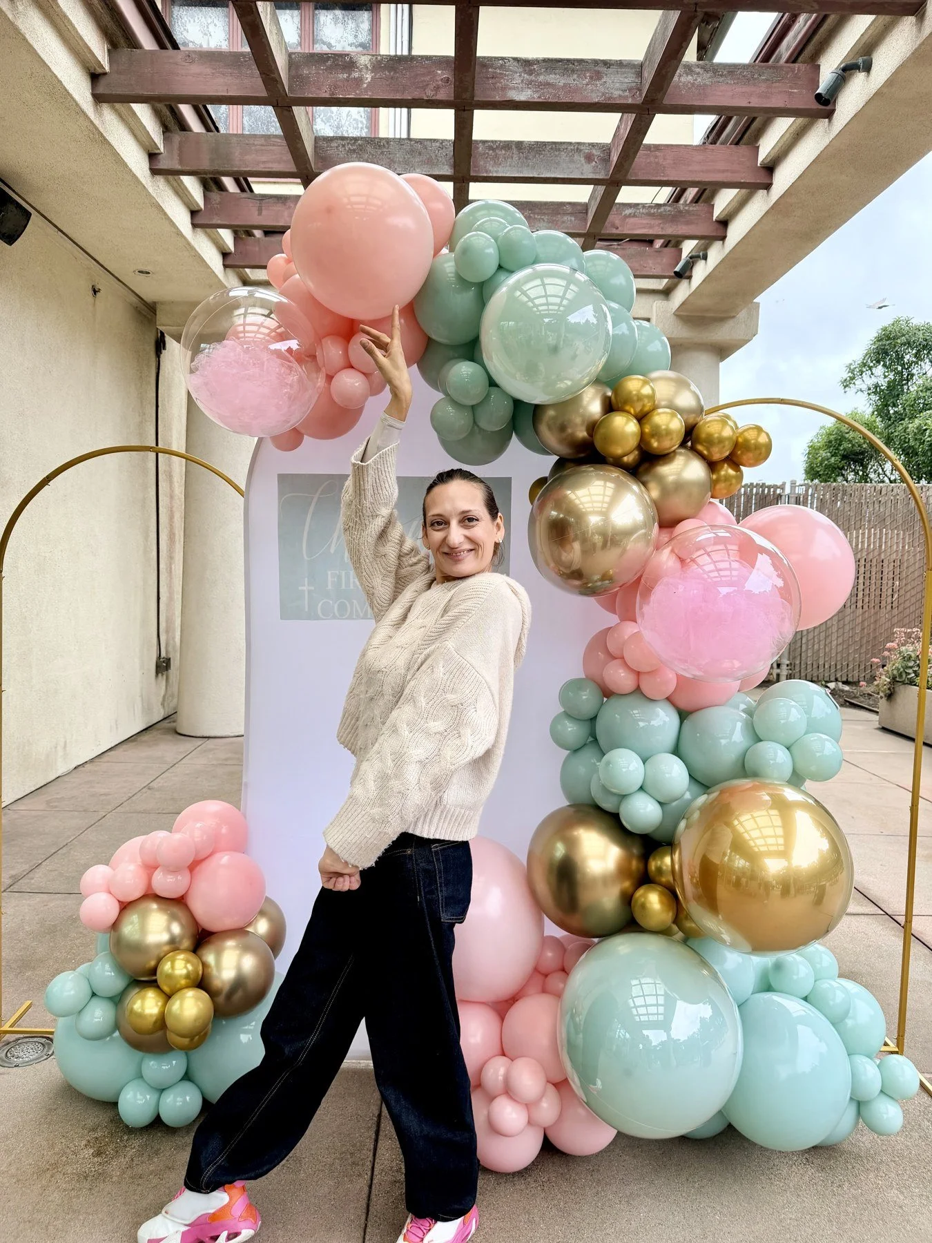 First Holy Communion in San Francisco | Pastel mint, pink and gold balloon photo backdrop.