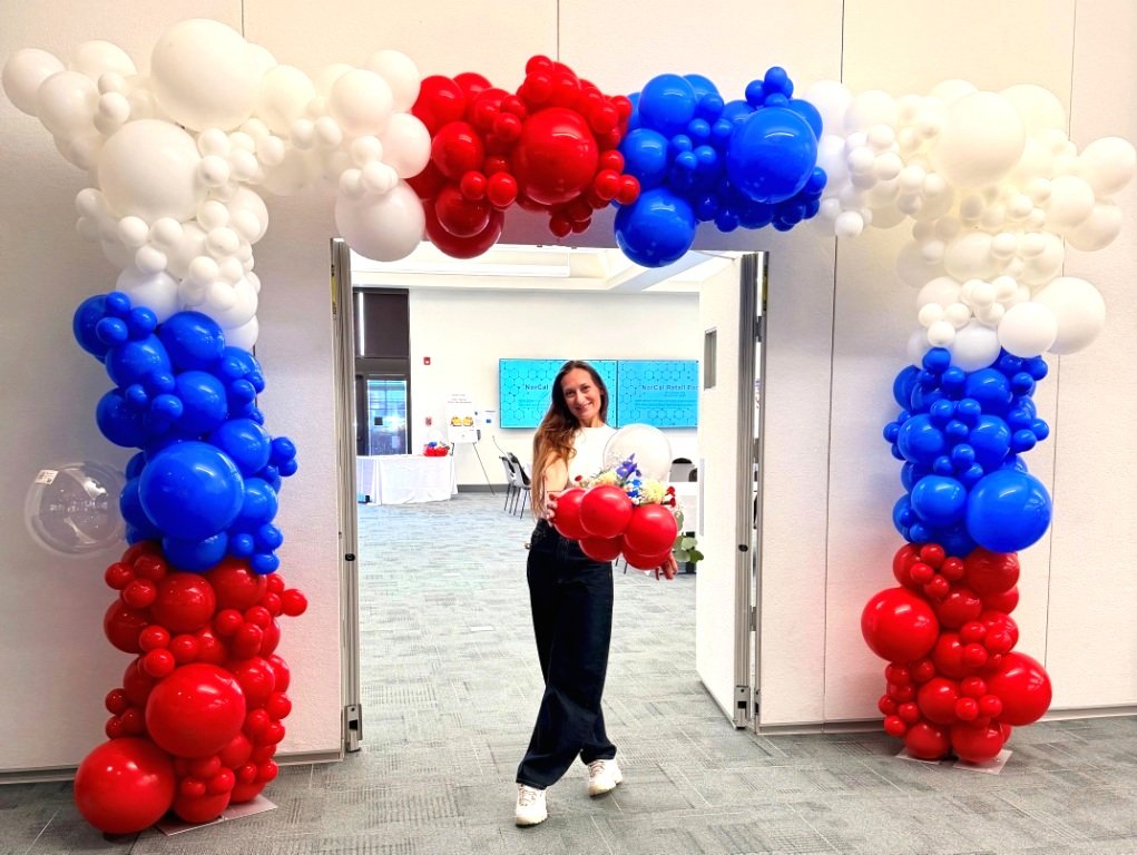 Red, white, and blue balloon arch at the entrance of Chevron headquarters in Oakland, California...jpg