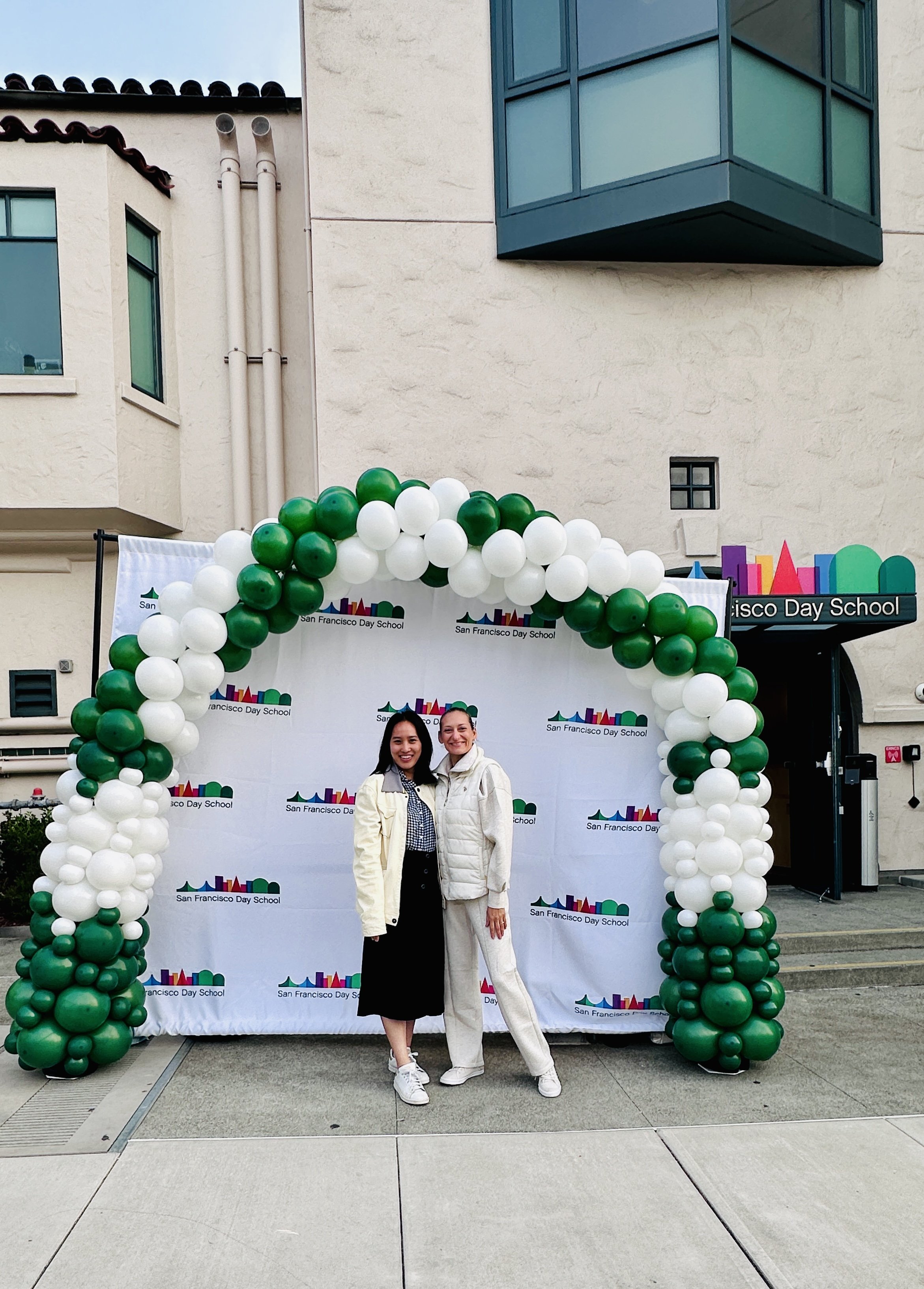 San Francisco Day School Welcome Event | Green and white balloon entrance arch.