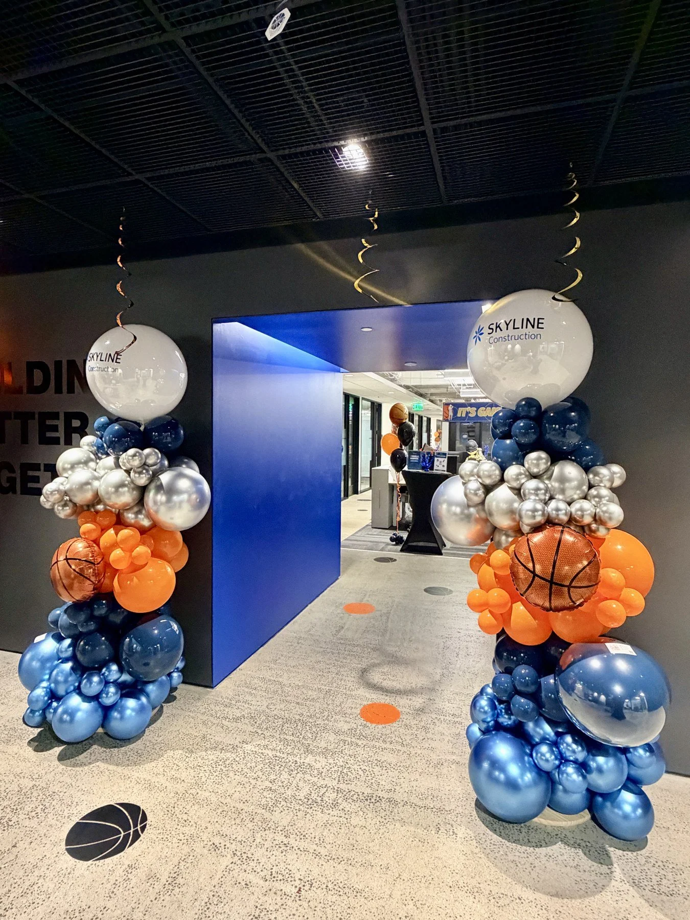 Skyline Construction March Madness Balloon Columns