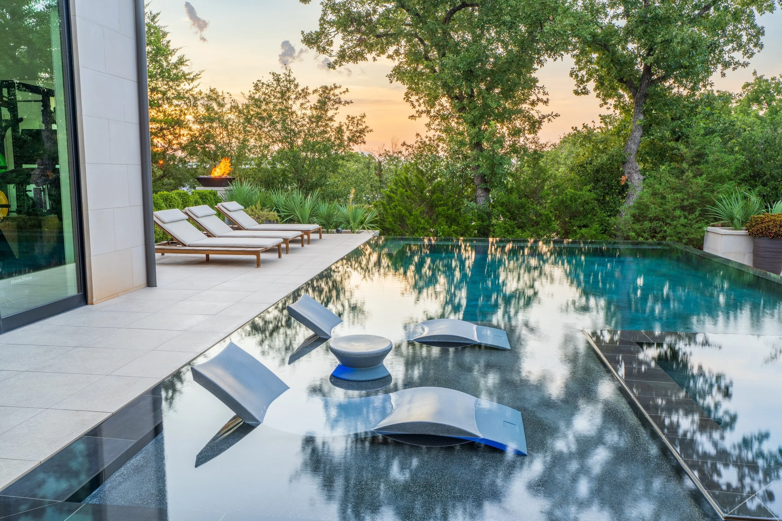 pool with tanning ledge and pool in Westlake, TX