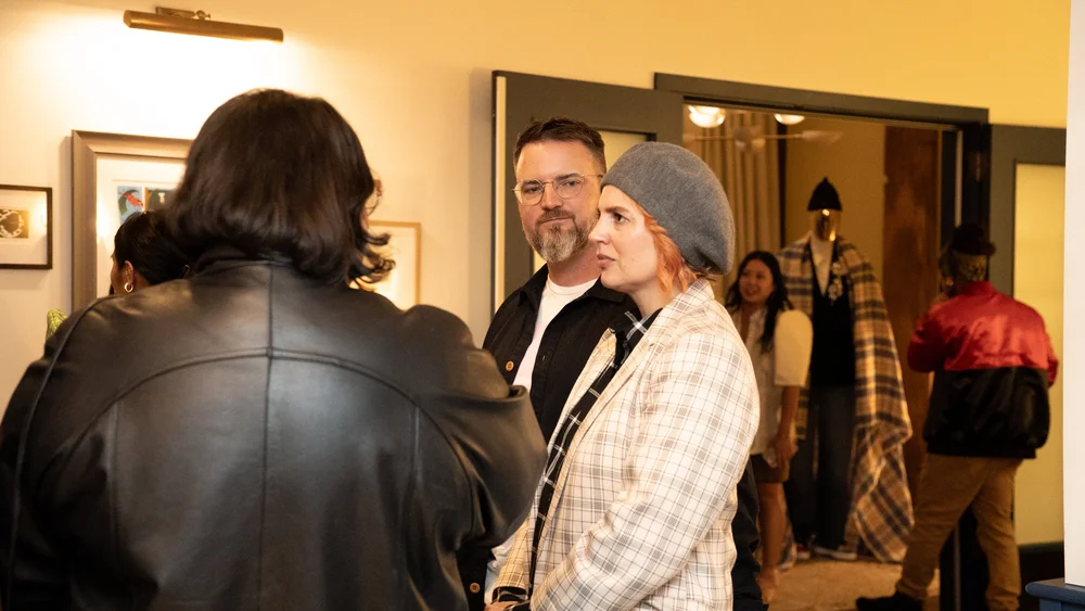 Guests at the Prologue backdrop