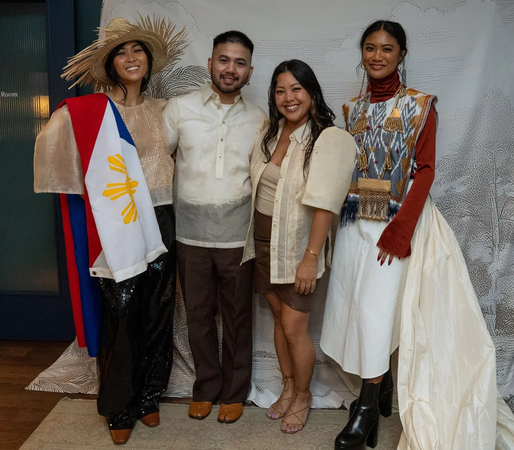 Guests at the Prologue backdrop