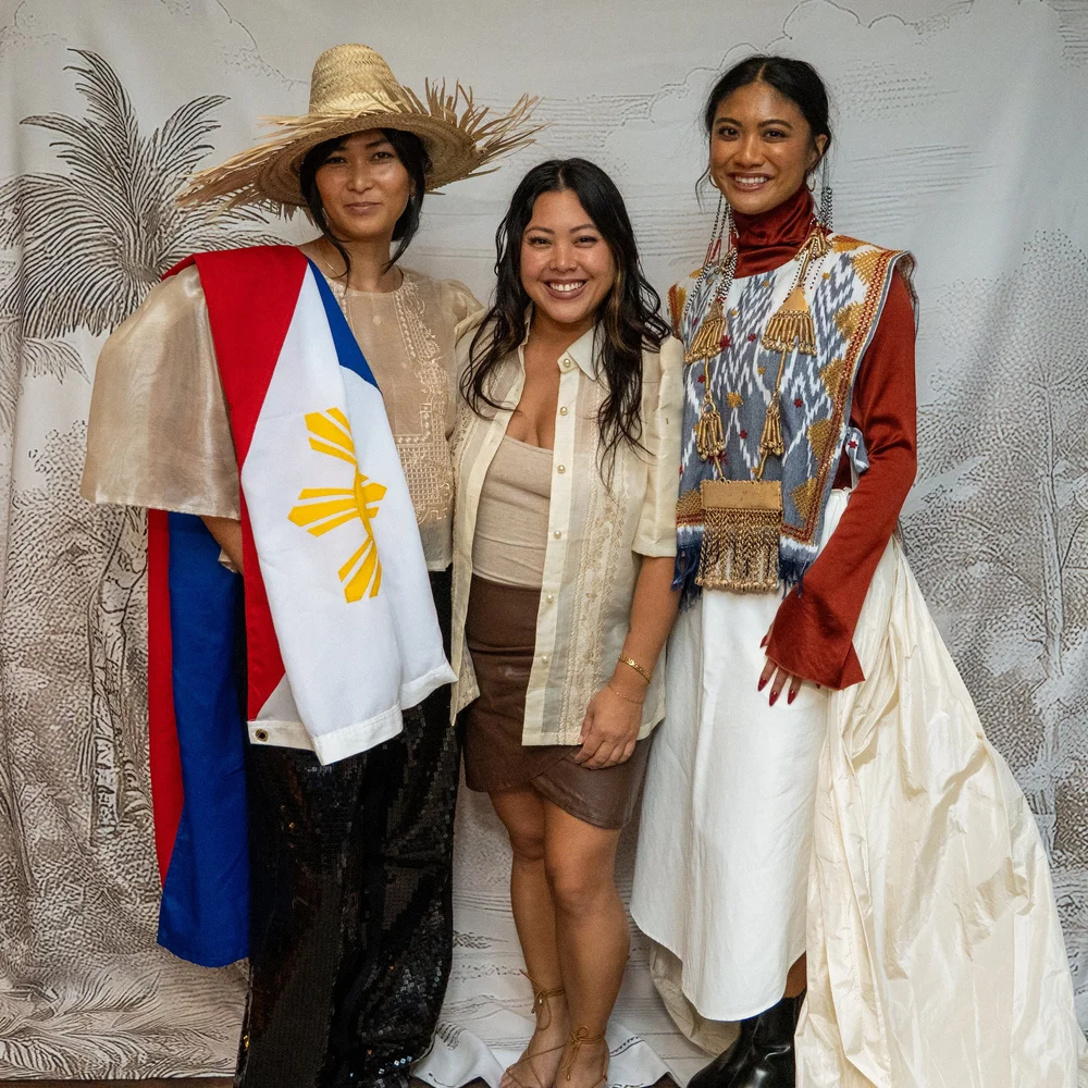 Guests at the Prologue backdrop