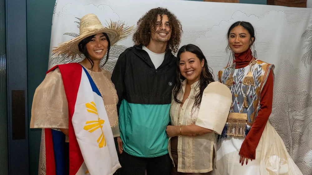 Guests at the Prologue backdrop