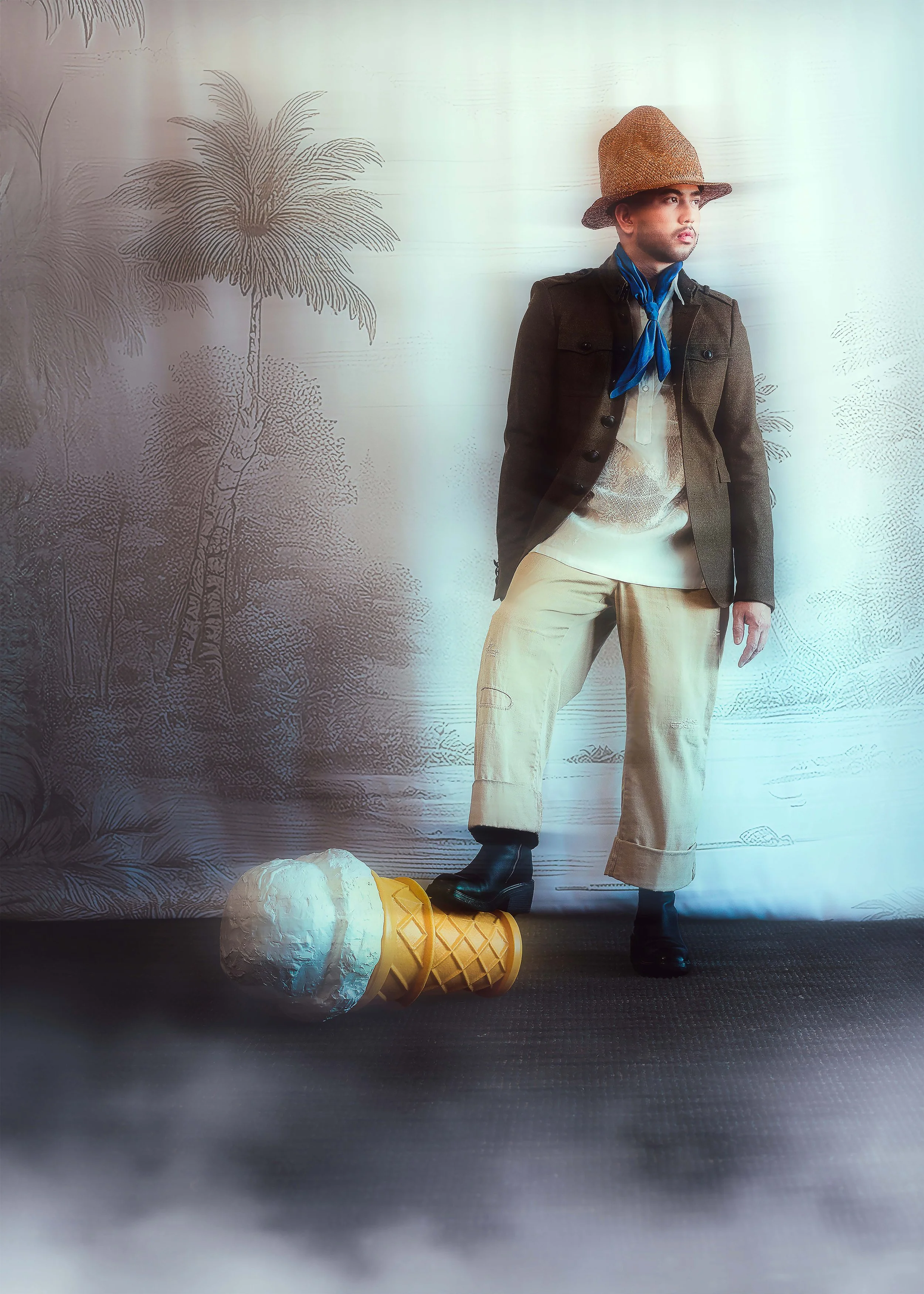 A man in a straw hat, abaca barong and khaki military jacket