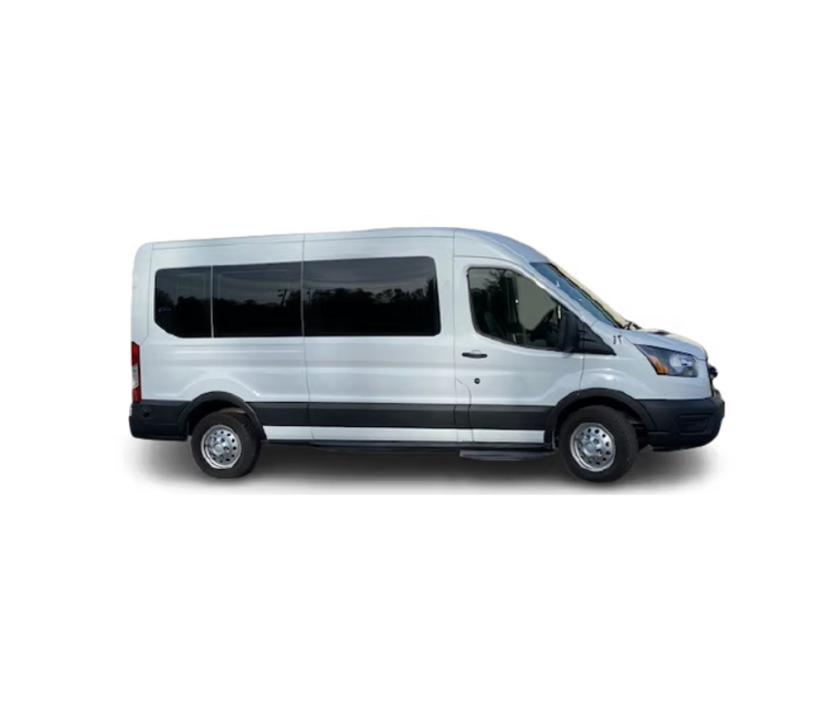 A white passenger van with tinted windows, black side trim, and silver wheels sliced through with a blue ribbon or banner