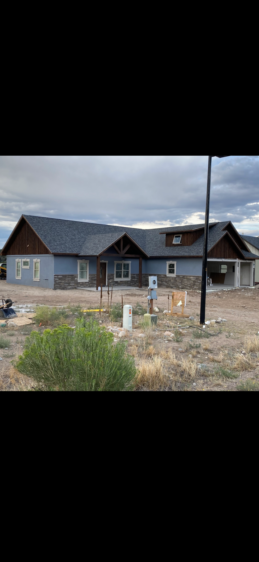 Oranssi technician working on a roof project
