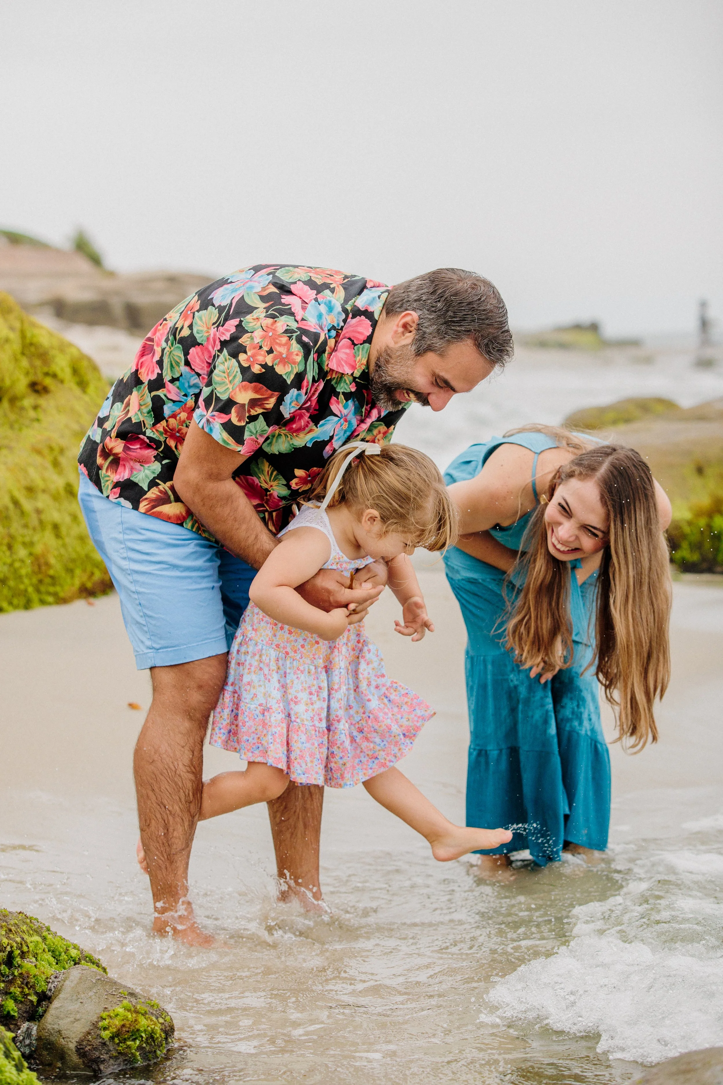 Candid photo during a family photography session on the beach in San Diego .jpg