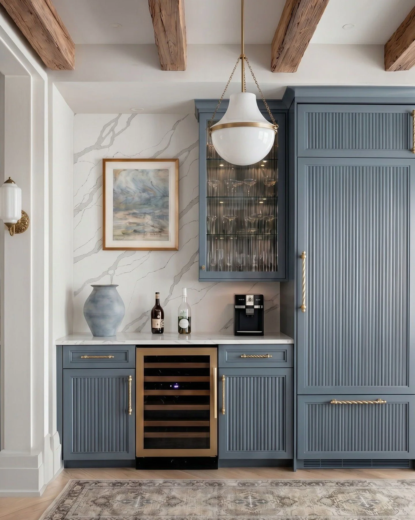 In spaces like this, Calacatta Nebbio Quartz doesn't compete with the cabinetry, wood beams, or brass accents. It ties everything together.

#KitchenDesign #KitchenInspiration #LuxuryKitchen #InteriorDesign #InteriorInspiration
