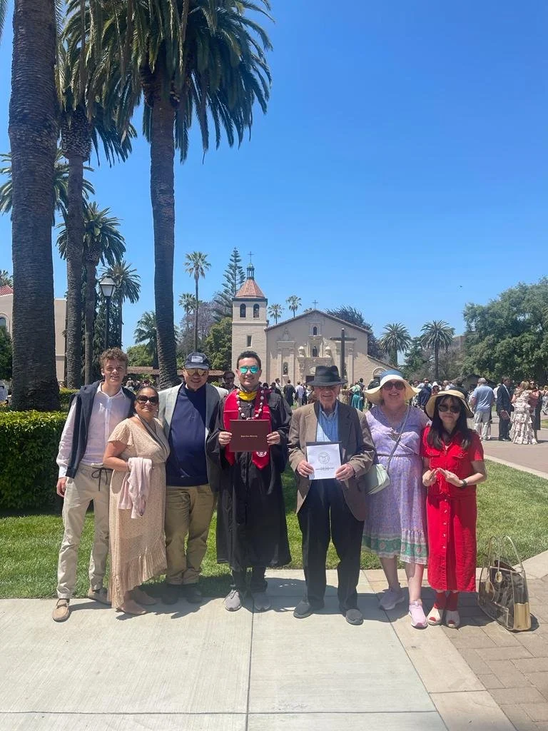 My maternal cousin, aunt, maternal grandpa, mom, dad, and family friend at my graduation ceremony, 2023