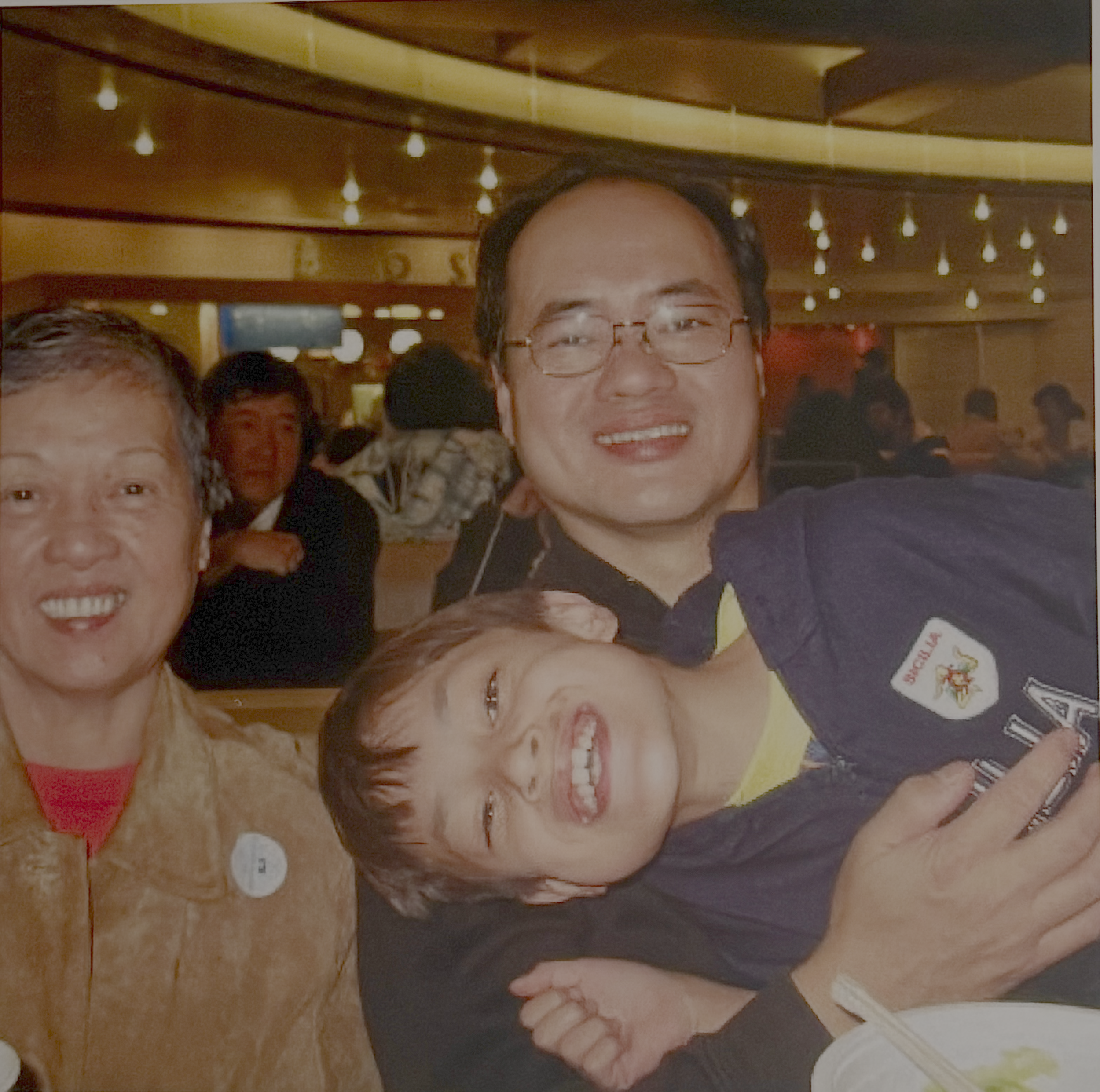My paternal grandmother, my dad, and I at a Chinese restaurant, 2009
