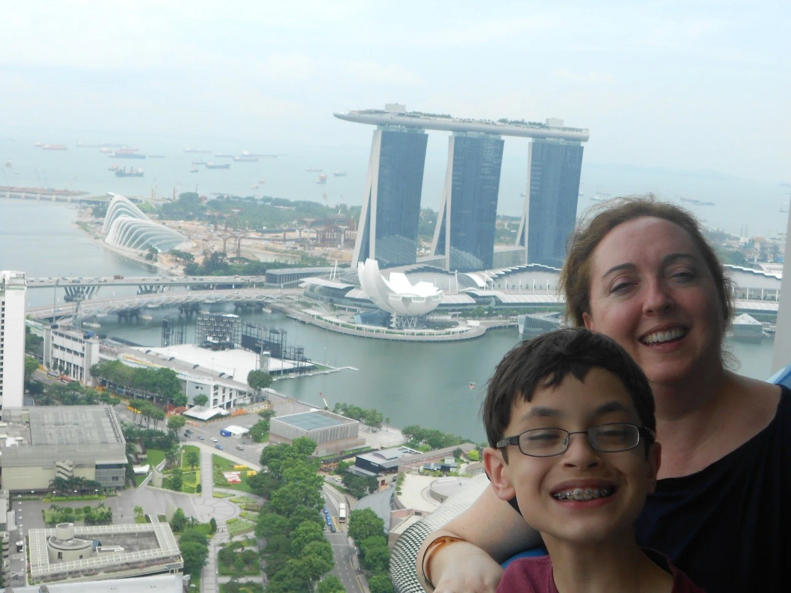 My mom and I on a balcony facing the Marina Bay Sands Resort, 2011