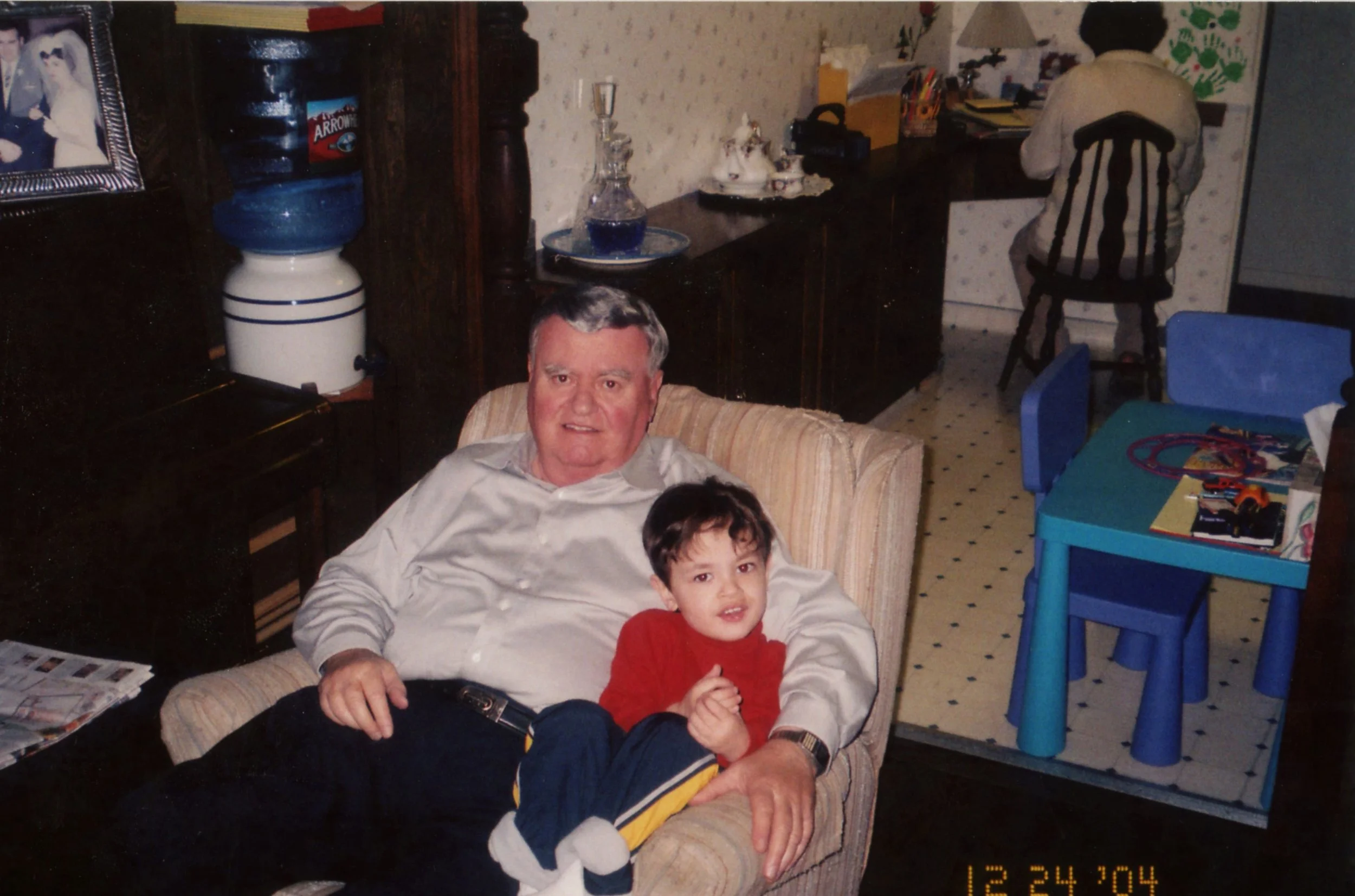 My maternal grandfather, Pepo, and I watching family Blockbuster video rentals and his personal VHS/DVD collection, 2004