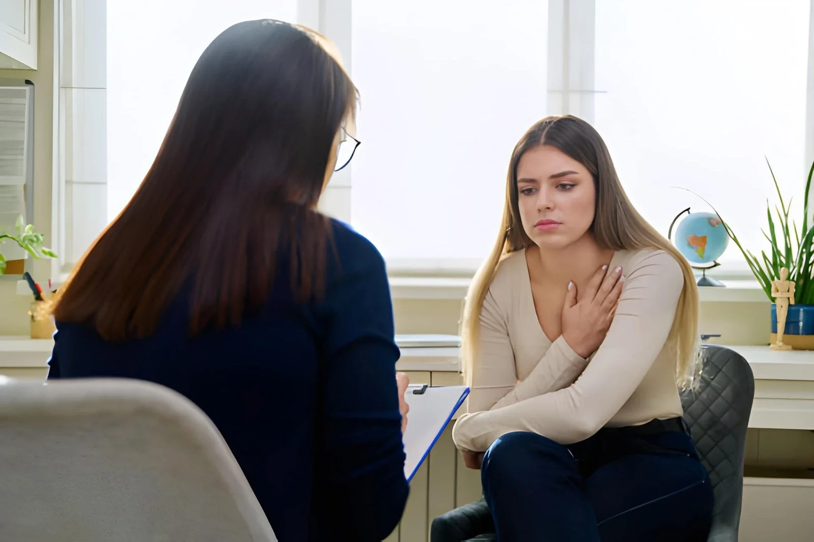 A lady in therapy session with a female therapist
