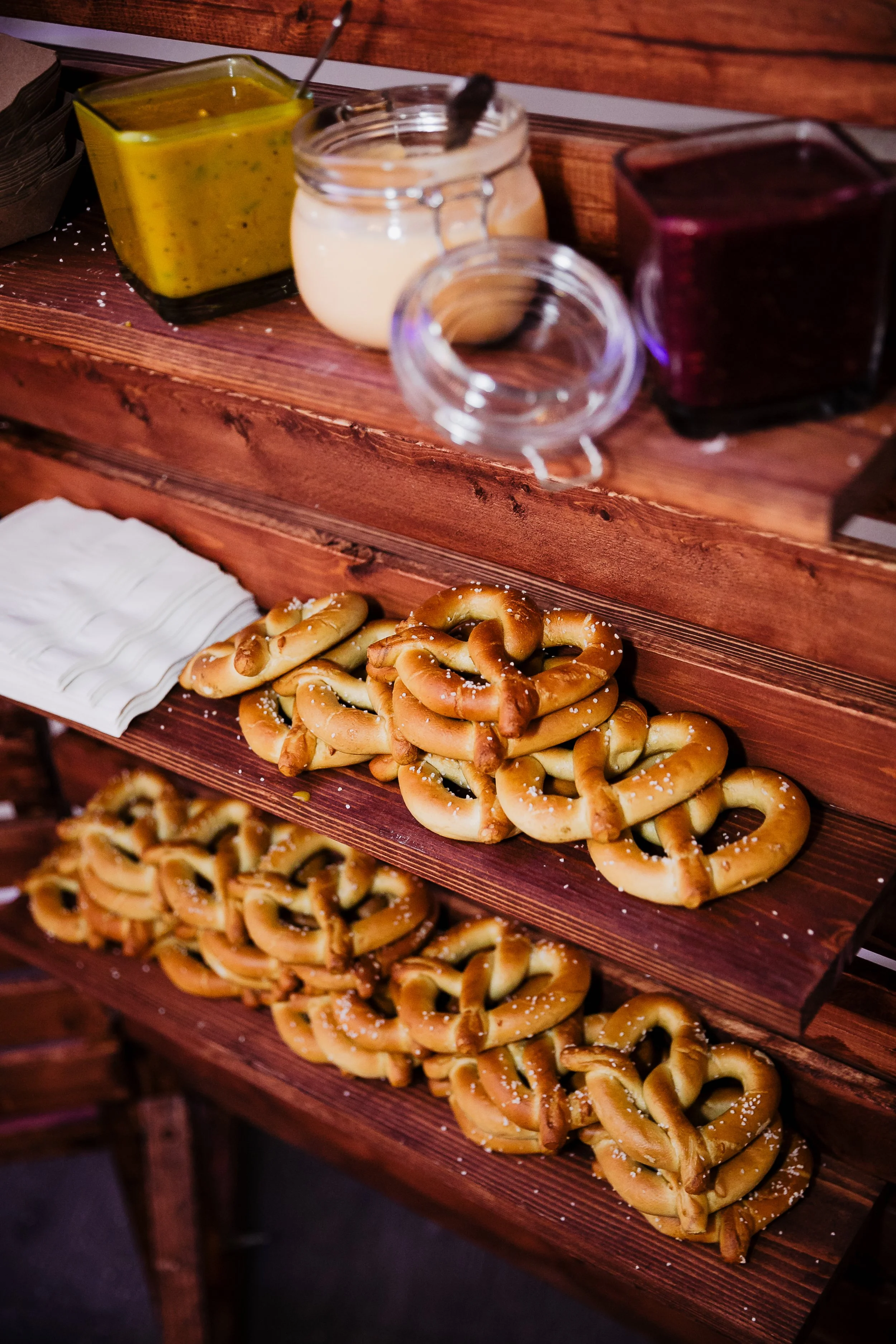 Pretzels decorated with coarse salt on wooden shelves