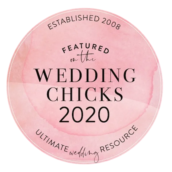 Pink circular badge with black text that reads 'Featured on the Wedding Chicks 2020'. Text also includes 'Established 2008' at the top and 'Ultimate wedding resource' at the bottom.