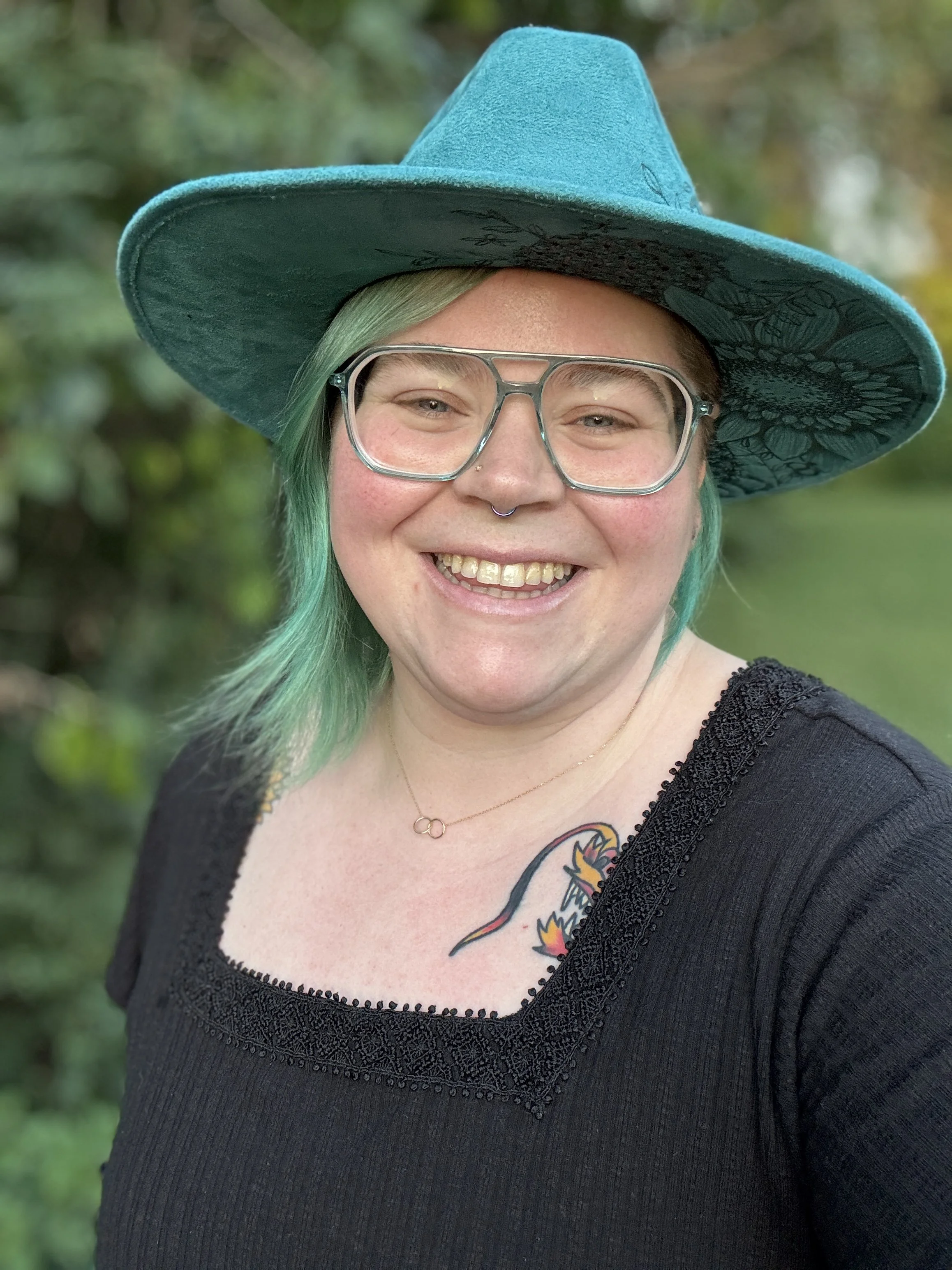 Logo for Aftercare Therapy Collective featuring a stylized crown made of three interlocking crown pieces, with the text ‘Aftercare Therapy Collective’ in gold on a black background.