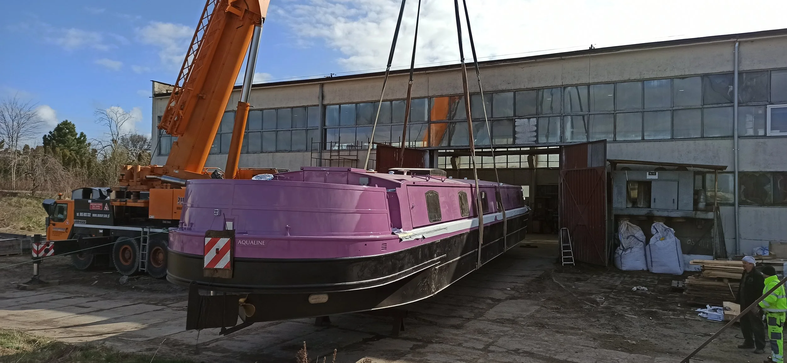 Being lifted by crane out of the workshop in Gdansk, Poland.