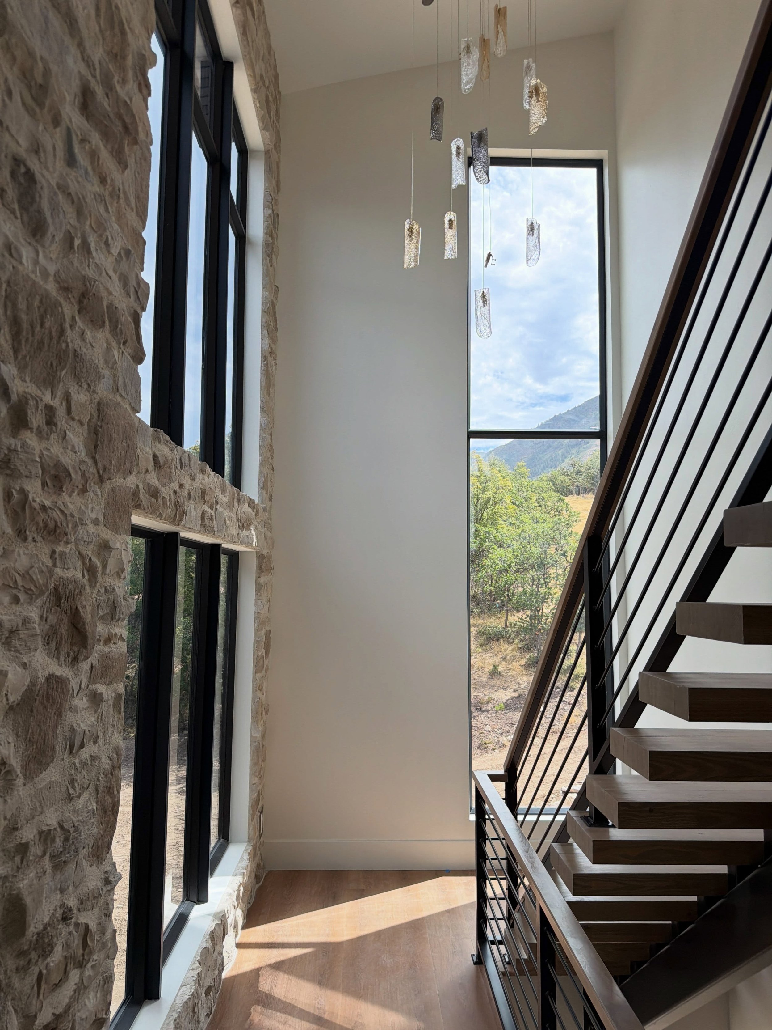 Recently completed in Woodland Hills, Utah.

This modern home features unique angled windows, a slimline multi-slide door, and a custom iron entry door, all designed to complement the home&rsquo;s architecture and take full advantage of some of the b