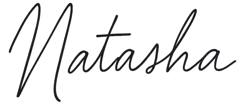 Stylized black cursive text spelling "Natasha".