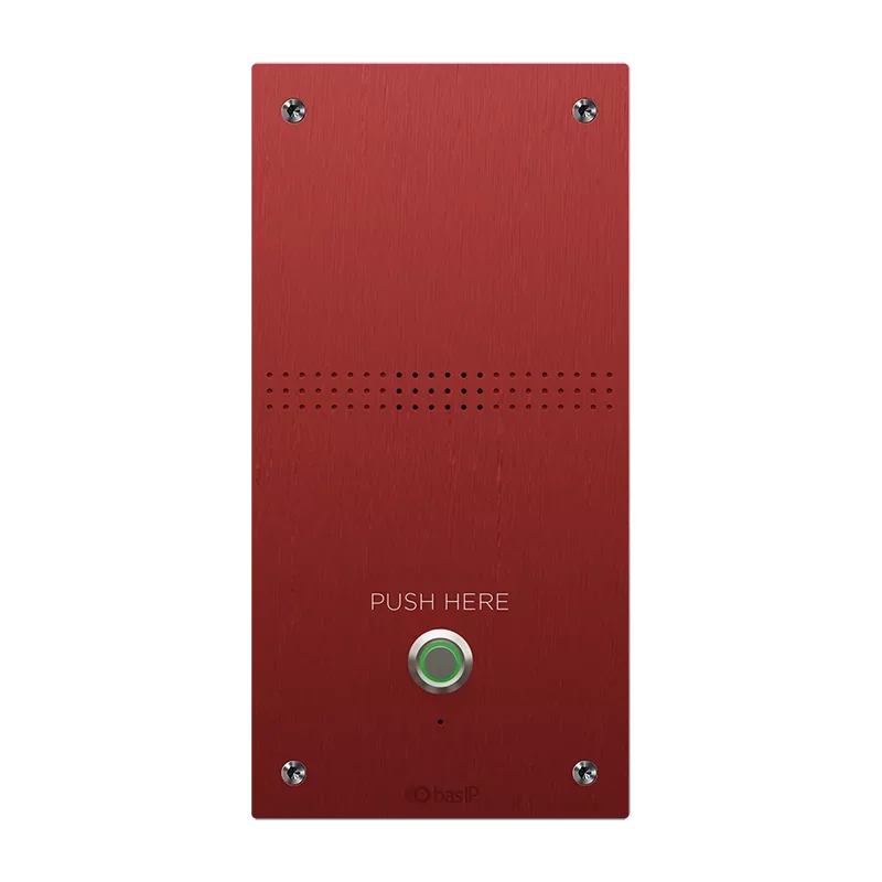 Red alarm or notification button panel with a green push button labeled 'PUSH HERE' and four screws at the corners.