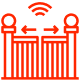 A wooden picket fence with a lattice top, surrounded by greenery and trees.