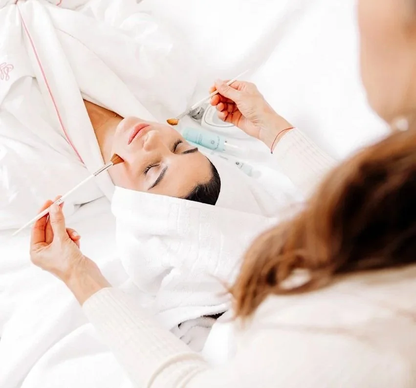 Daniela Nikolova, celebrity beauty and wellness expert in London performing a beauty routine on a VIP client.