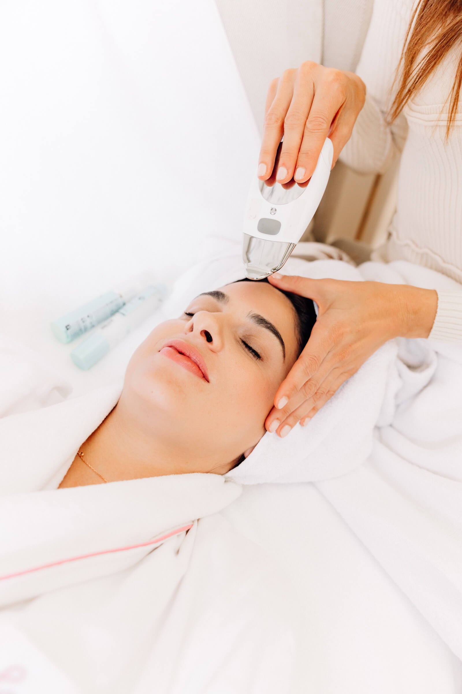 Daniela Nikolova performing luxury facial treatment in client's home in London