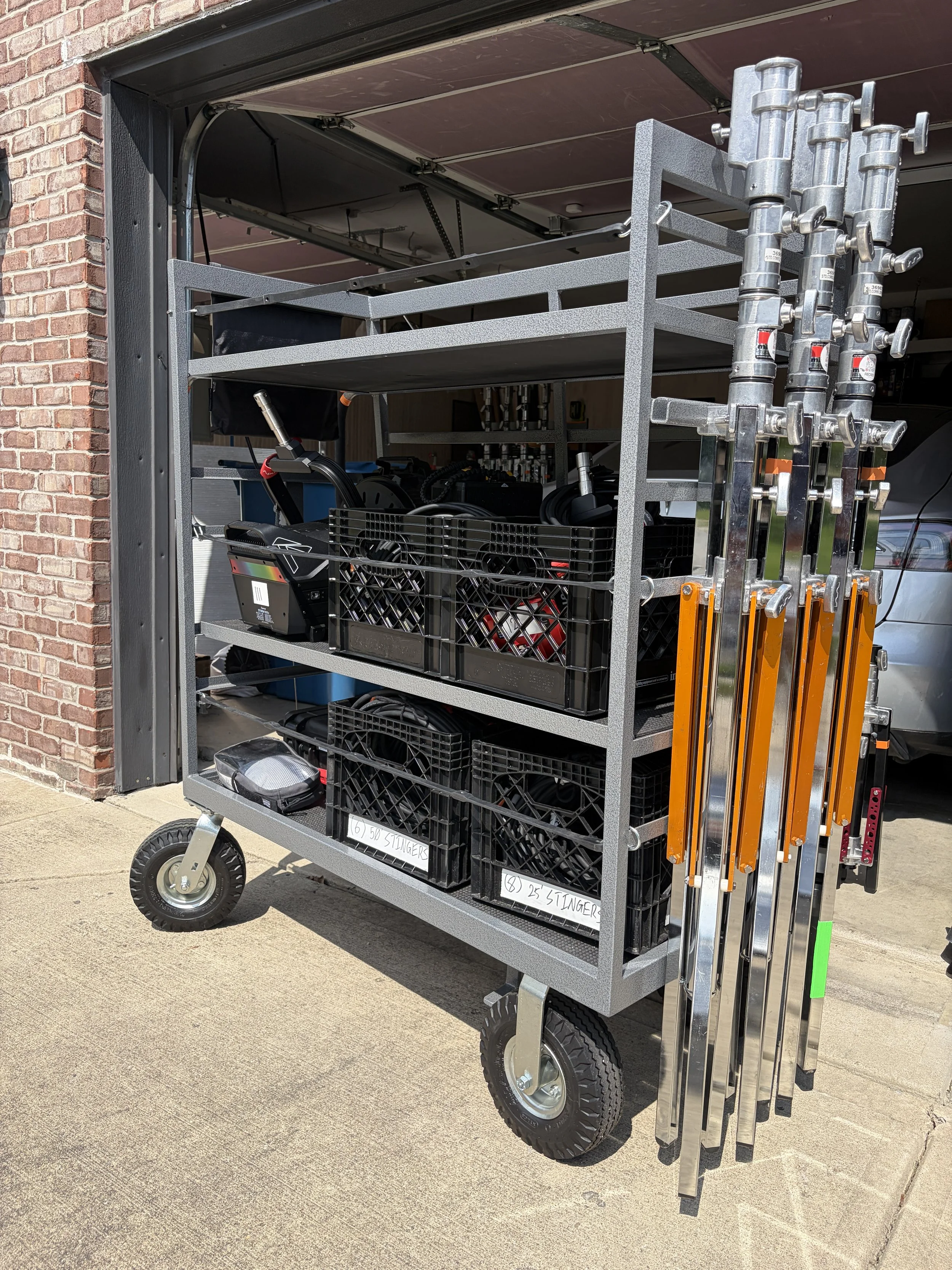 Studio carts mini head cart with aputure 1000c, aputure 400x, aputure infinibars, aputure mc pros, matthews combo stands, and aputure spotlight max on an Indianapolis 1 ton grip truck
