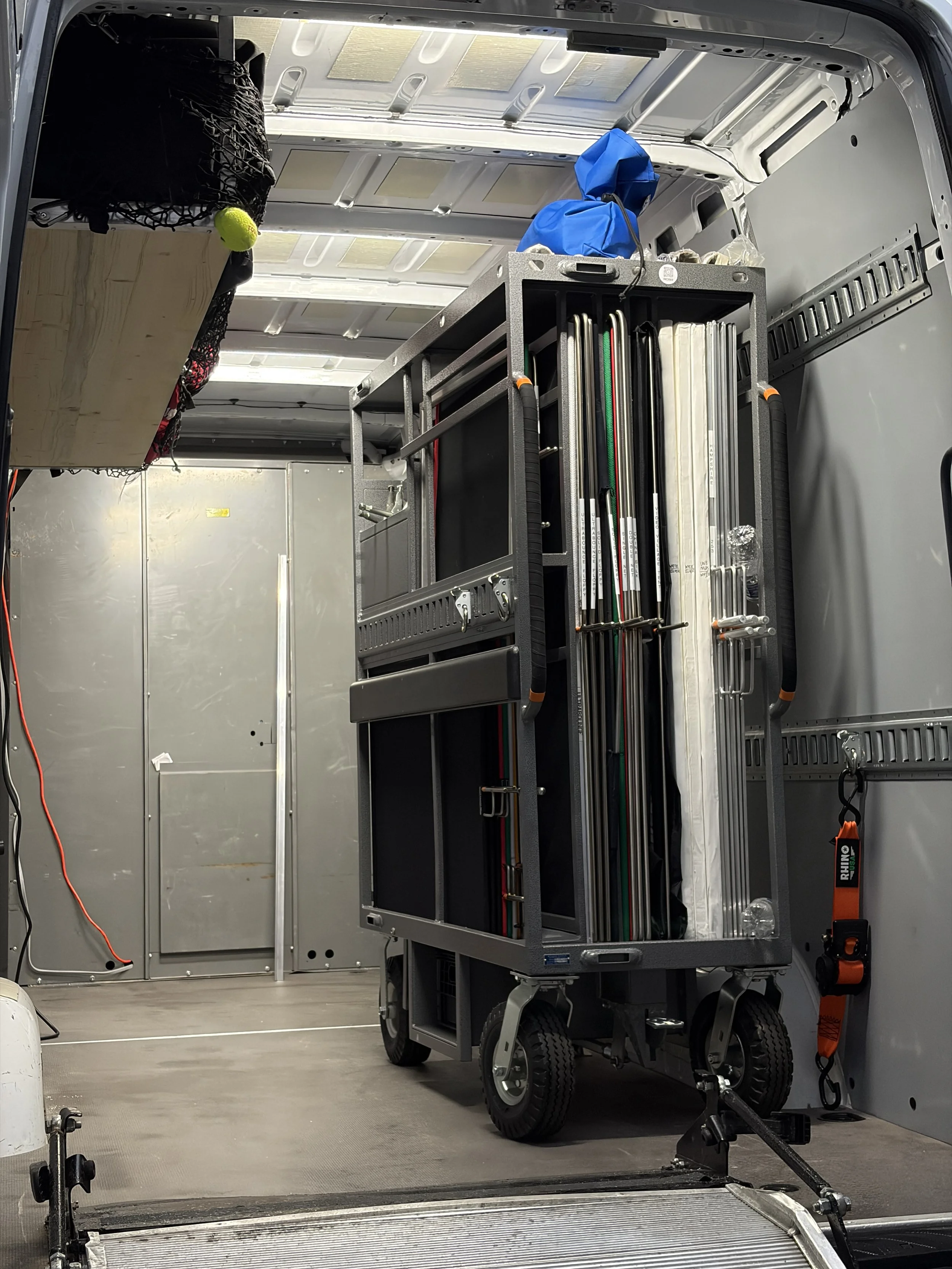 4x4 studio cart with flags, diffusion, rolls of gels, and foam cores. The cart is in an Indianapolis 1 ton grip truck