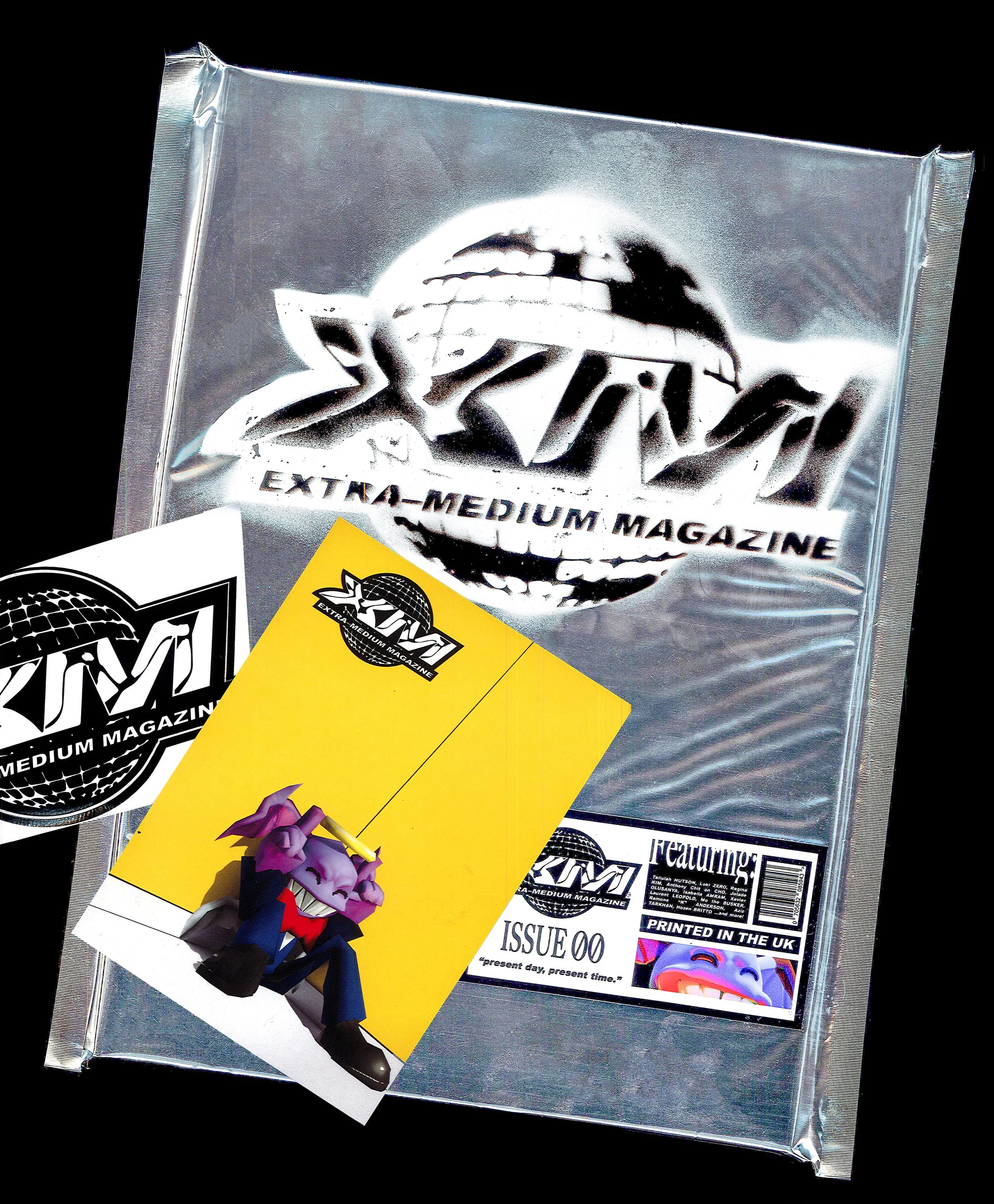 XM MAG WITH STICKER + POSTCARD EDIT.jpg