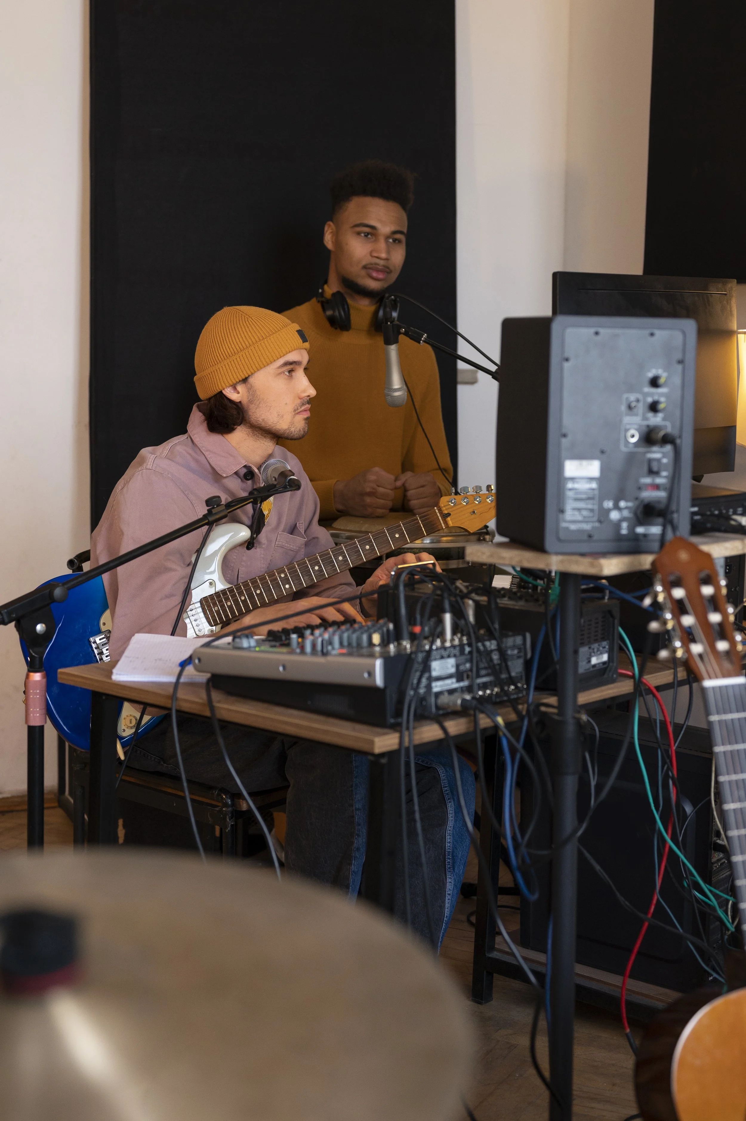 side-view-musicians-working-studio.jpg
